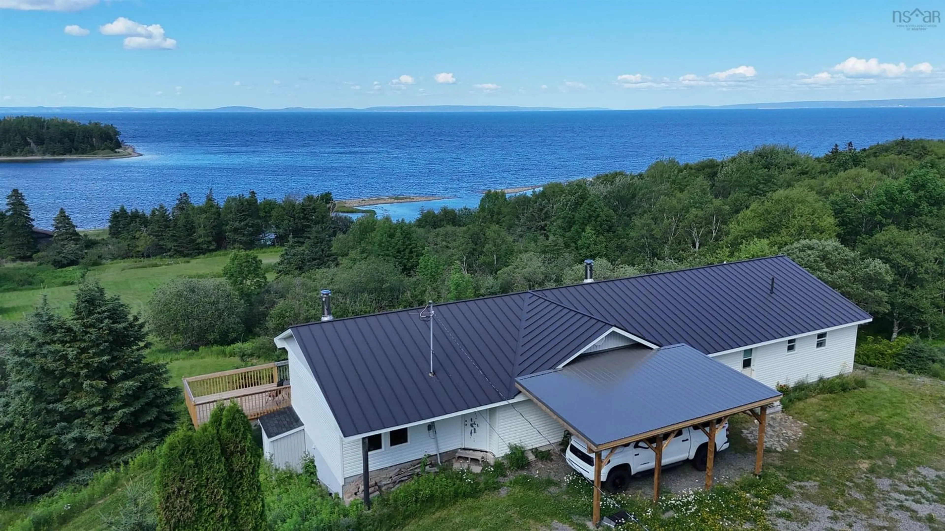 A pic from outside/outdoor area/front of a property/back of a property/a pic from drone, water/lake/river/ocean view for 5877 West Bay Rd, Roberta Nova Scotia B0E 3K0