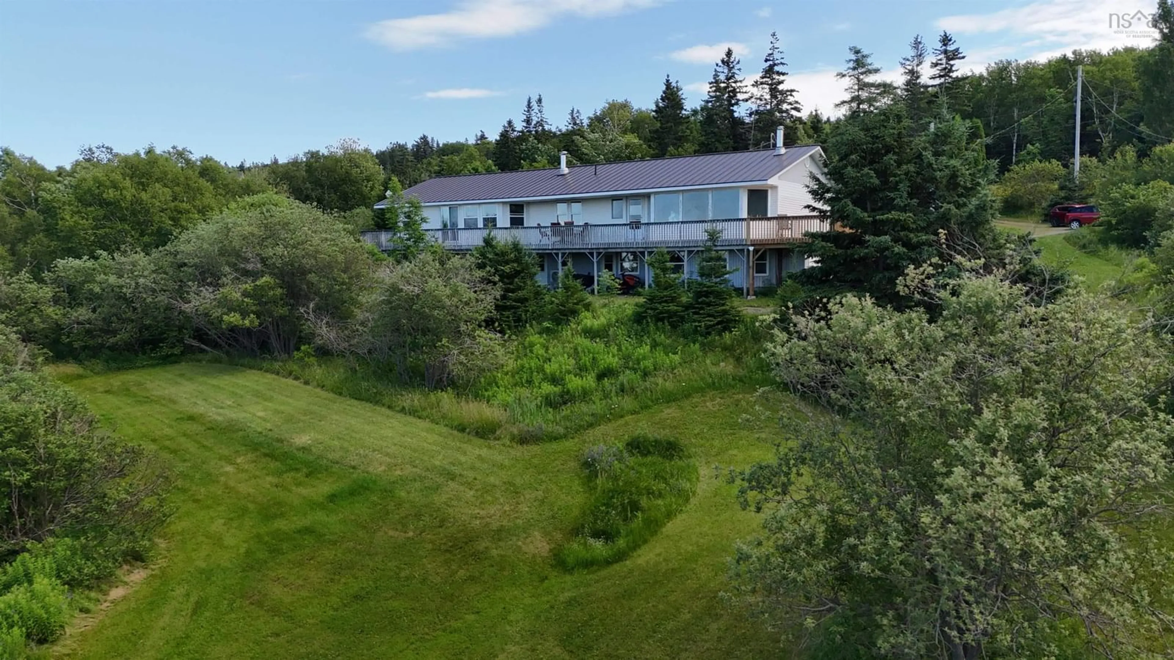 A pic from outside/outdoor area/front of a property/back of a property/a pic from drone, unknown for 5877 West Bay Rd, Roberta Nova Scotia B0E 3K0