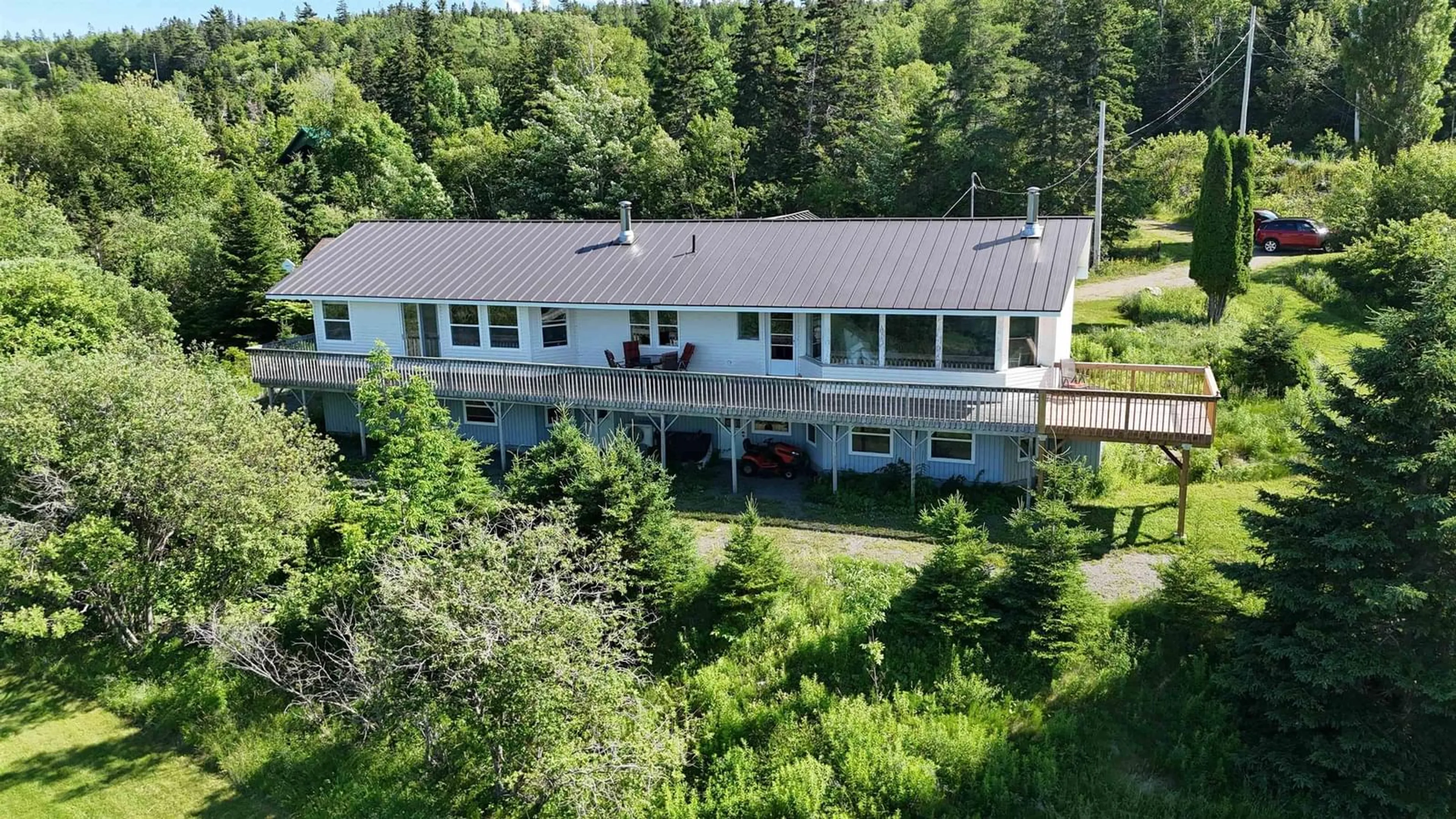 A pic from outside/outdoor area/front of a property/back of a property/a pic from drone, unknown for 5877 West Bay Rd, Roberta Nova Scotia B0E 3K0