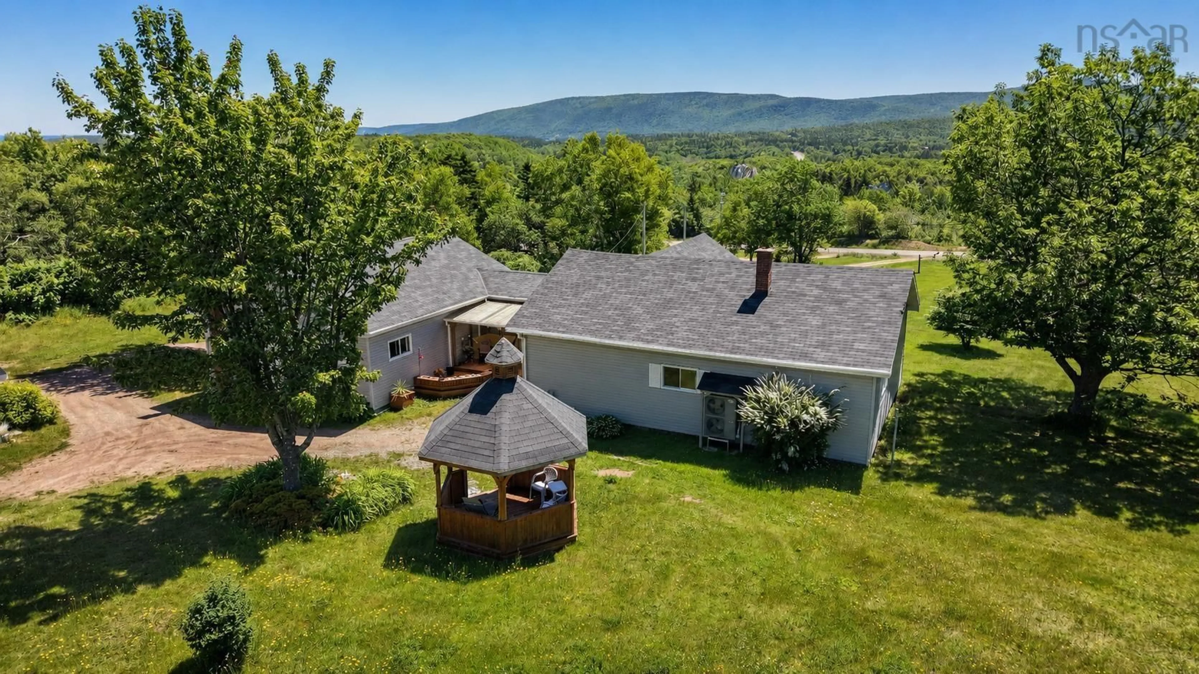 A pic from outside/outdoor area/front of a property/back of a property/a pic from drone, mountain view for 29389 Cabot Trail, Cape North Nova Scotia B0C 1G0