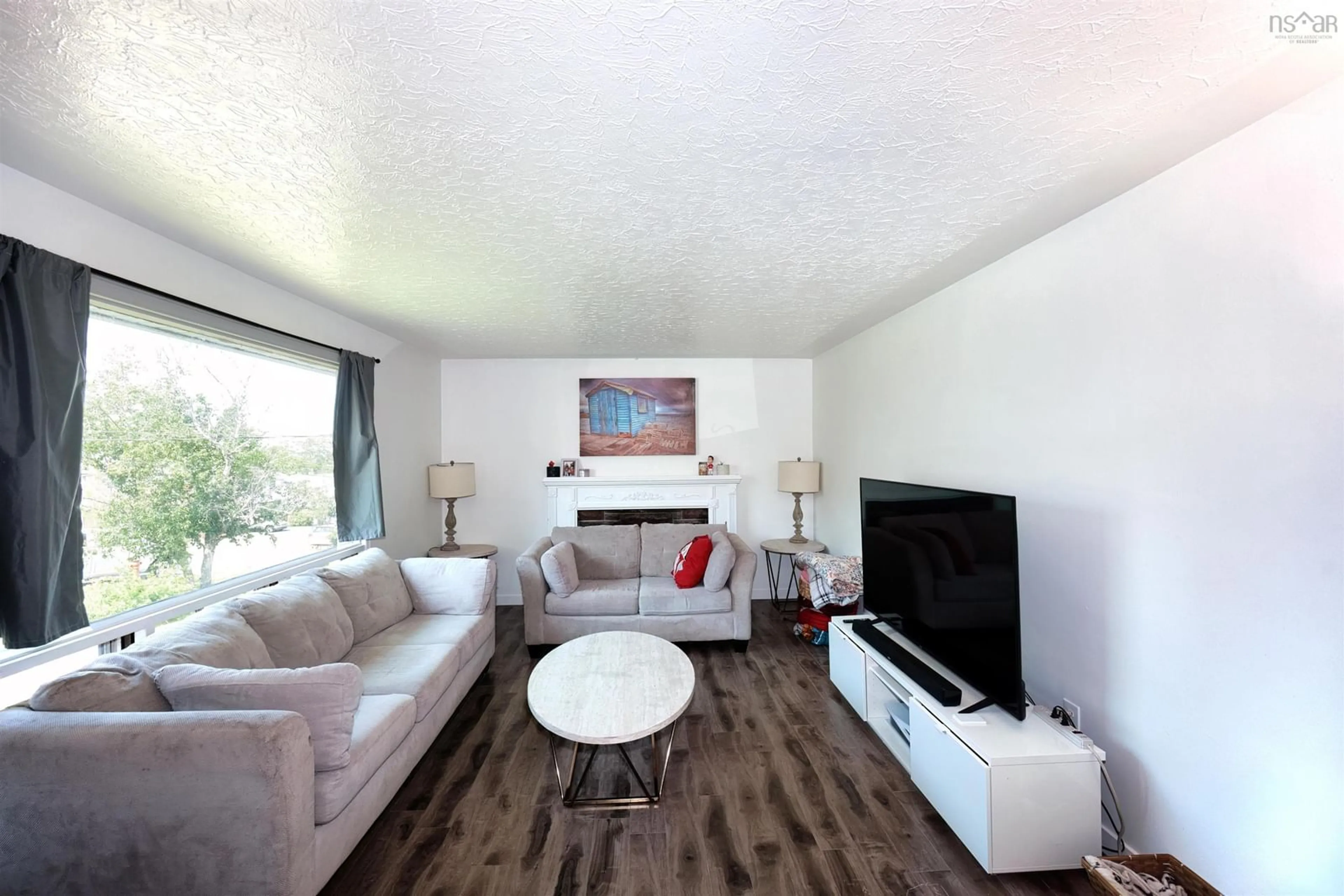 Living room with furniture, wood/laminate floor for 34 Hilden Dr, Halifax Nova Scotia B3R 1K2