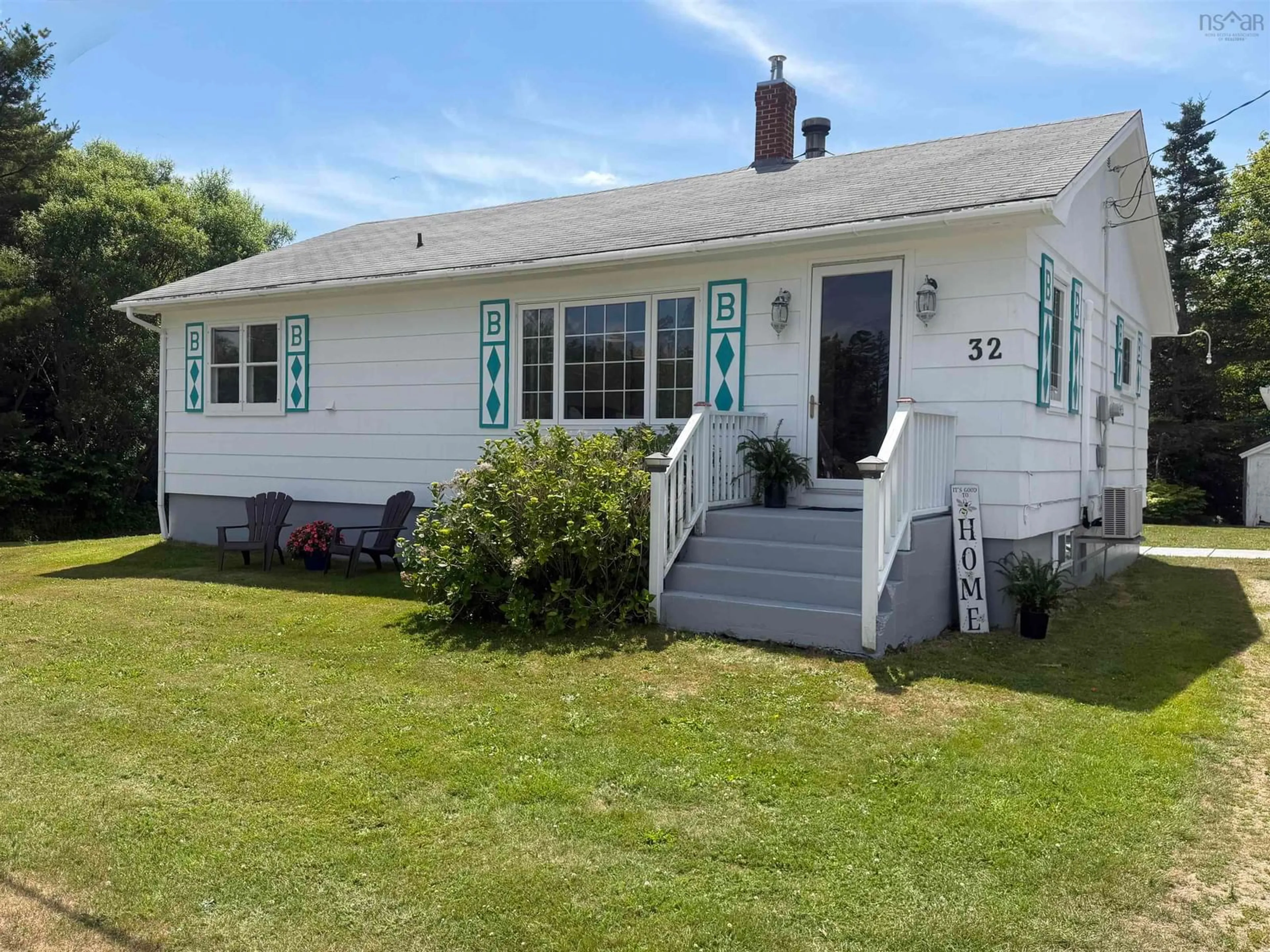 Home with vinyl exterior material, street for 32 New Rd, Lower Wedgeport Nova Scotia B0W 2B0
