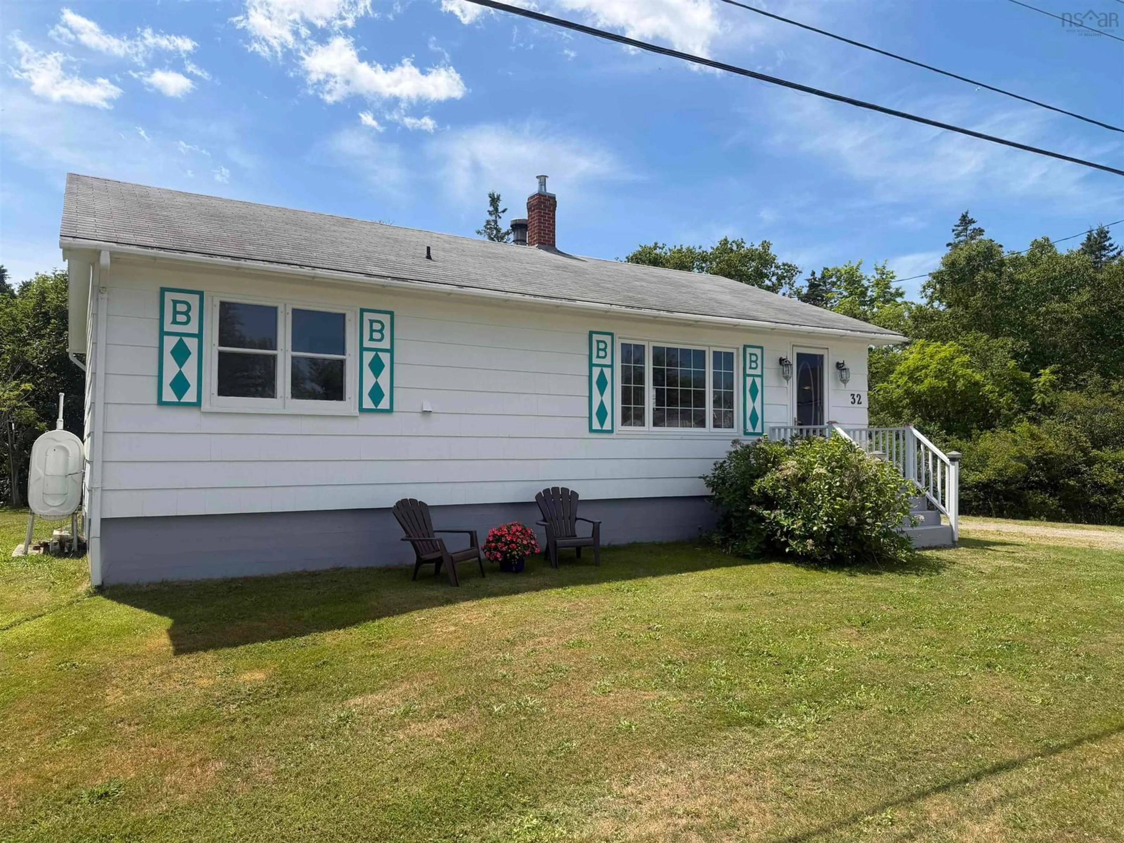 Home with vinyl exterior material, street for 32 New Rd, Lower Wedgeport Nova Scotia B0W 2B0