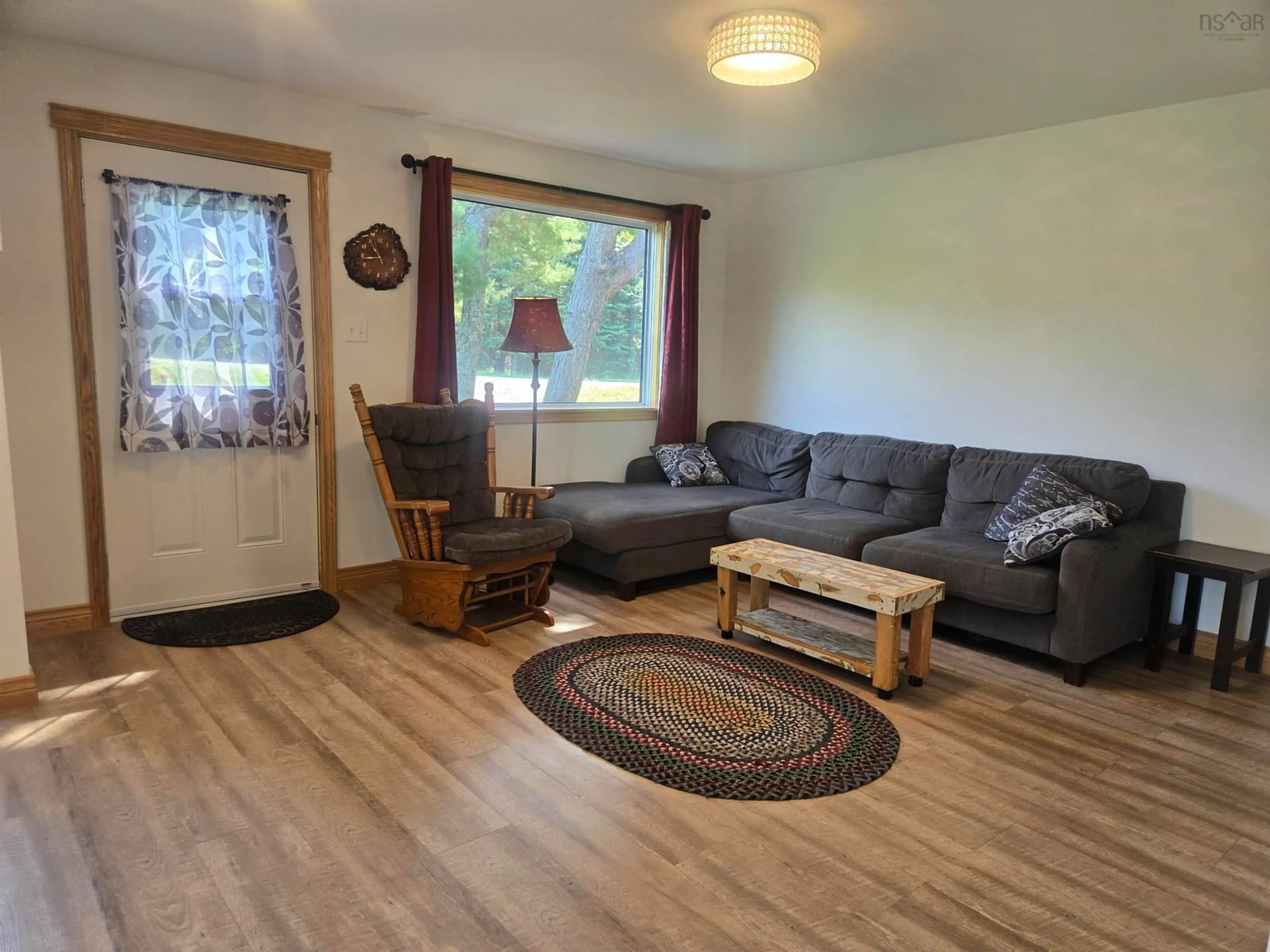 Living room with furniture, wood/laminate floor for 365 Sand Point Rd, Tatamagouche Nova Scotia B0K 1V0