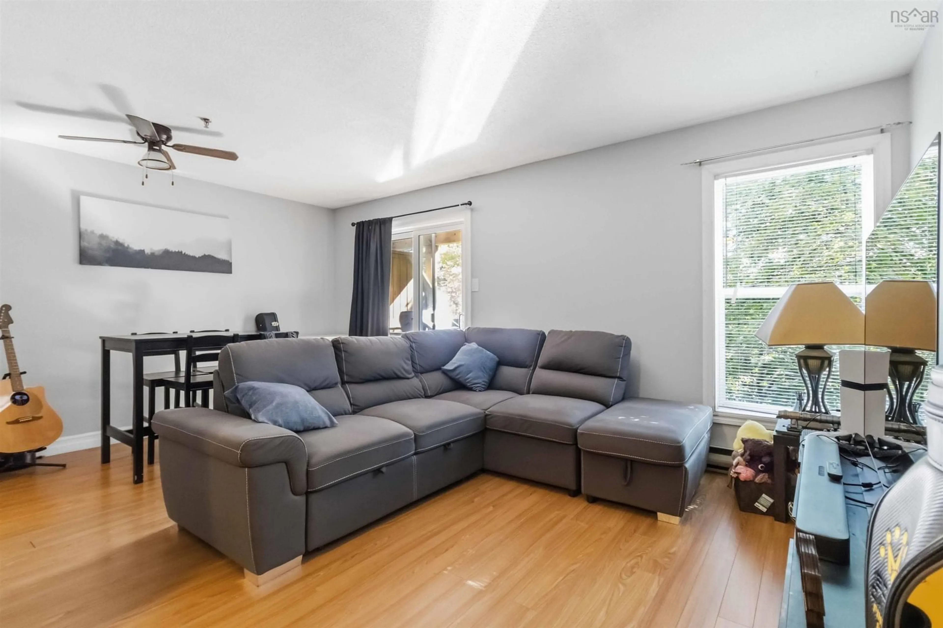 Living room with furniture, wood/laminate floor for 75 Collins Grove #107, Dartmouth Nova Scotia B2W 6B3
