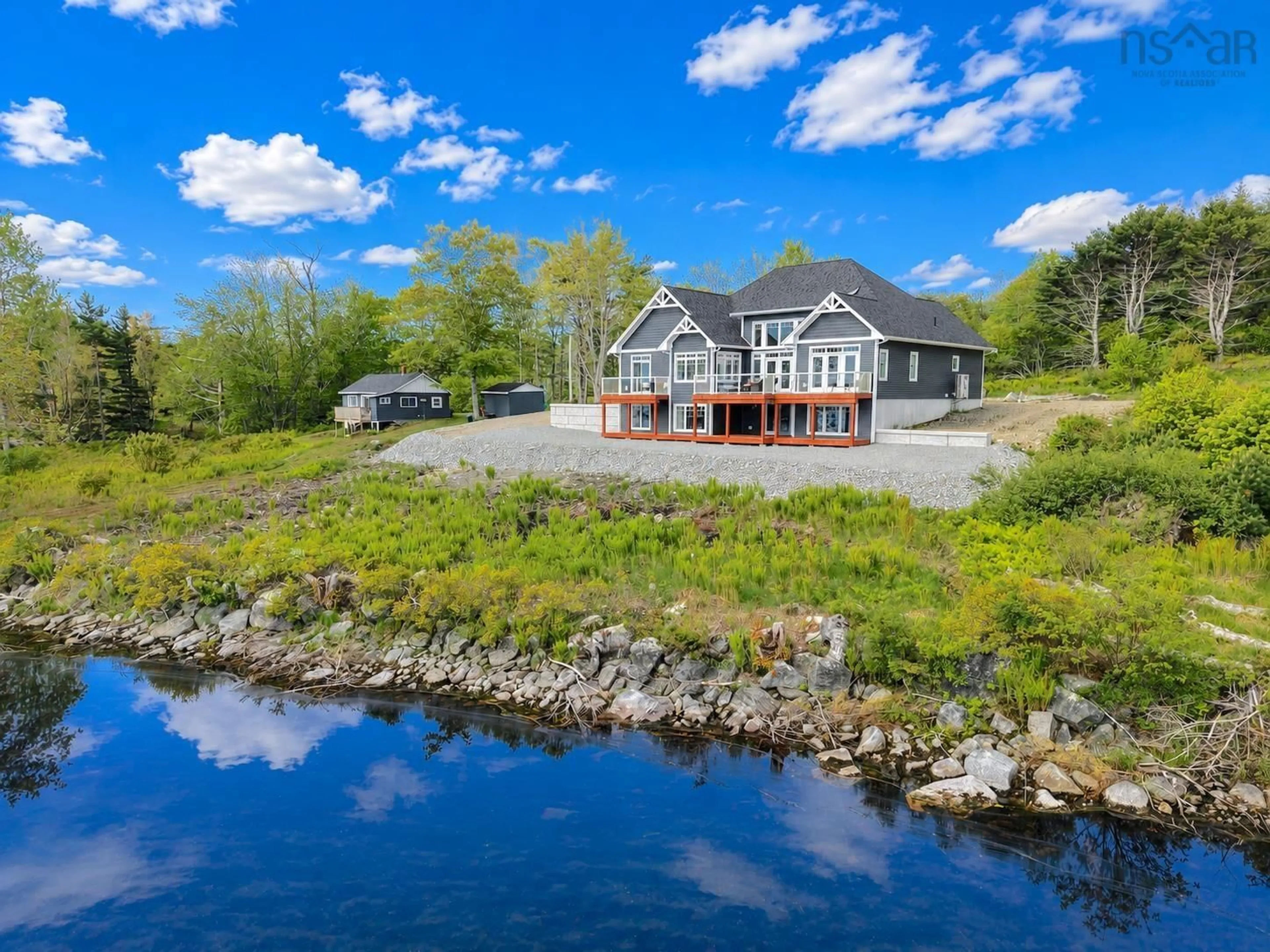 A pic from outside/outdoor area/front of a property/back of a property/a pic from drone, water/lake/river/ocean view for 3224 203 Hwy, Middle Ohio Nova Scotia B0T 1W0