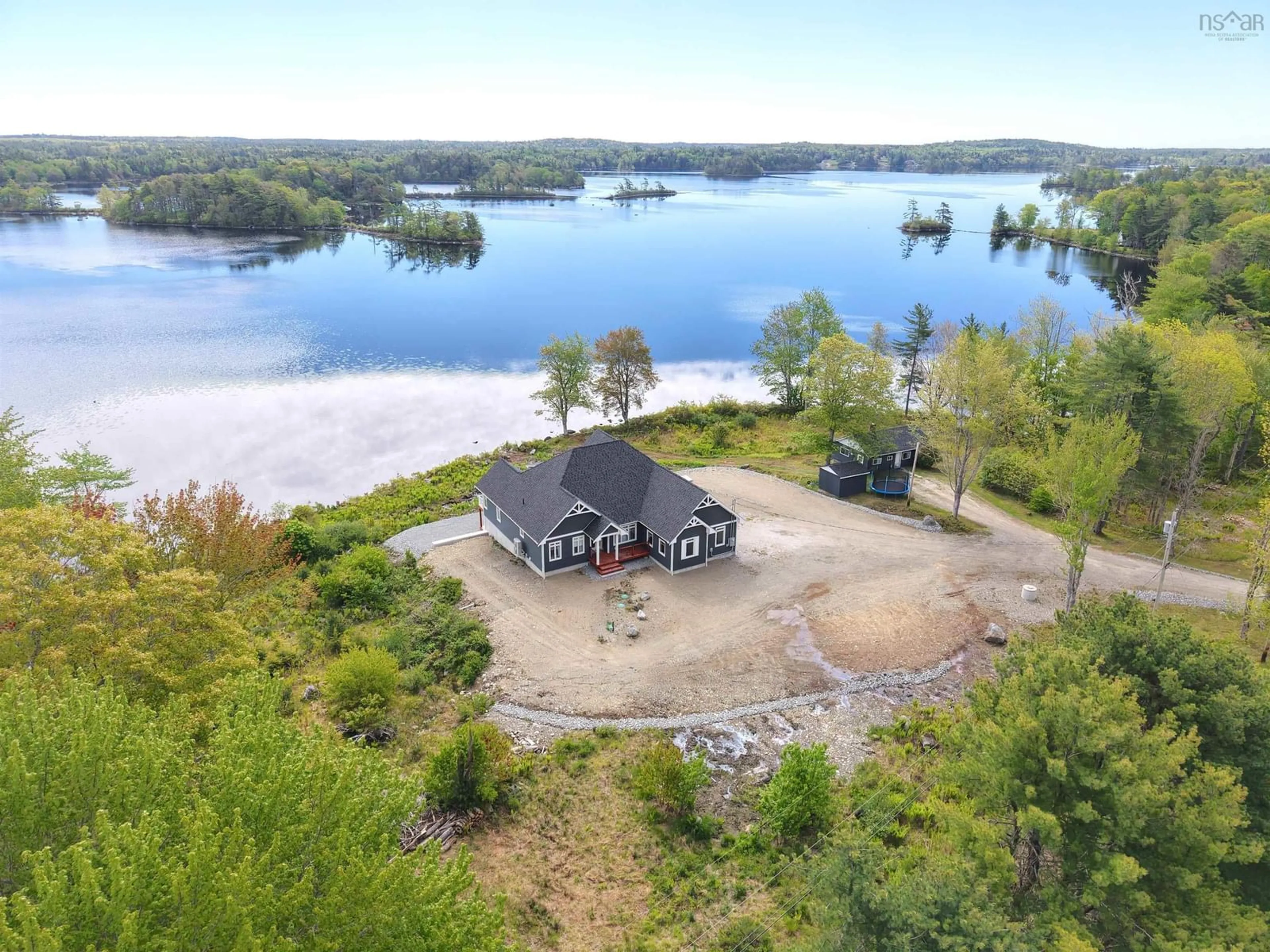 A pic from outside/outdoor area/front of a property/back of a property/a pic from drone, water/lake/river/ocean view for 3224 203 Hwy, Middle Ohio Nova Scotia B0T 1W0
