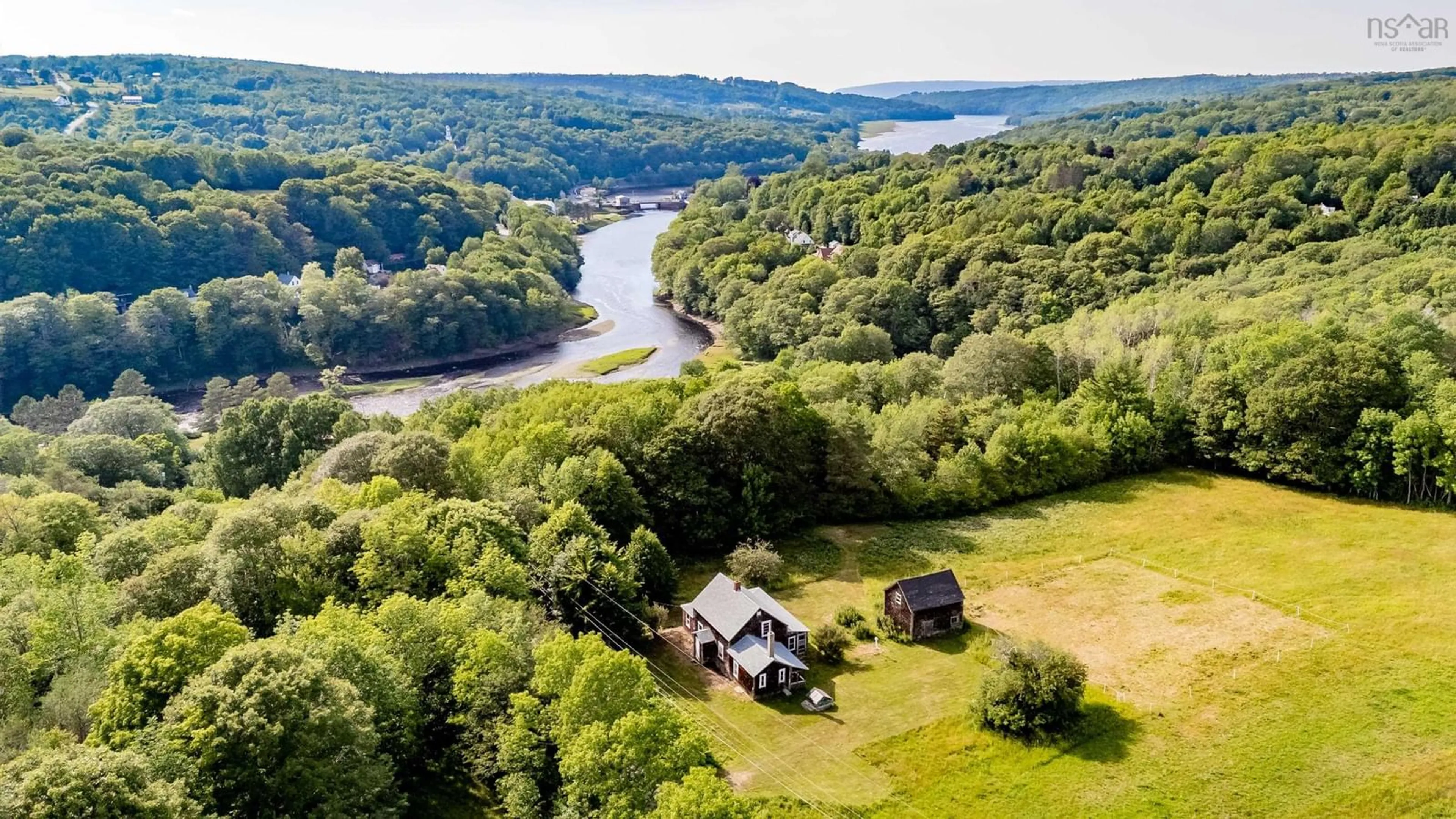 A pic from outside/outdoor area/front of a property/back of a property/a pic from drone, water/lake/river/ocean view for 134 Pecks Hill Rd, Bear River Nova Scotia B0S 1B0
