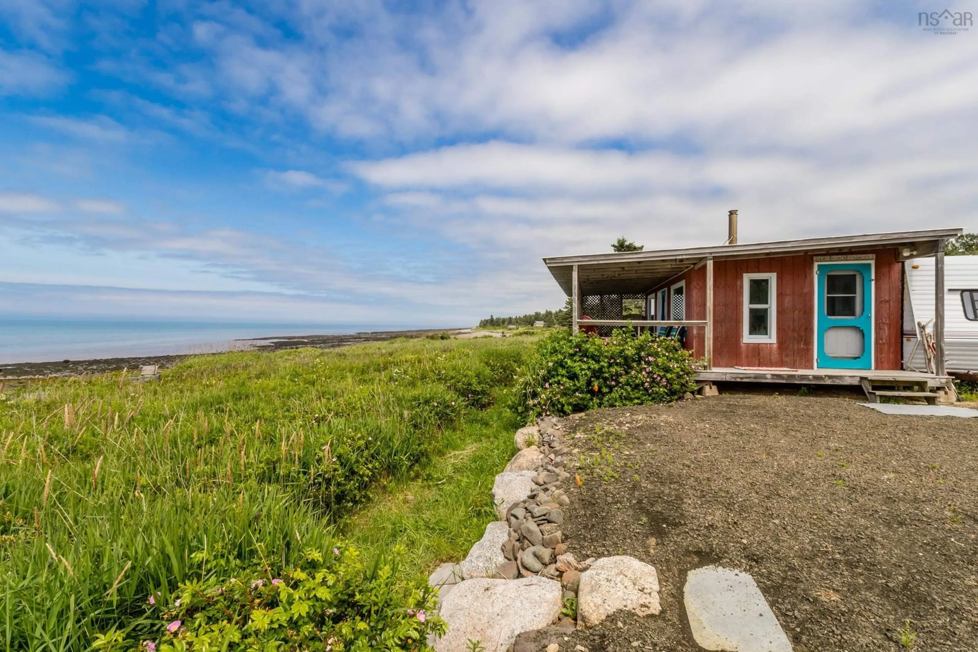 A pic from outside/outdoor area/front of a property/back of a property/a pic from drone, water/lake/river/ocean view for 6737 Shore Rd, Phinneys Cove Nova Scotia B0S 1L0