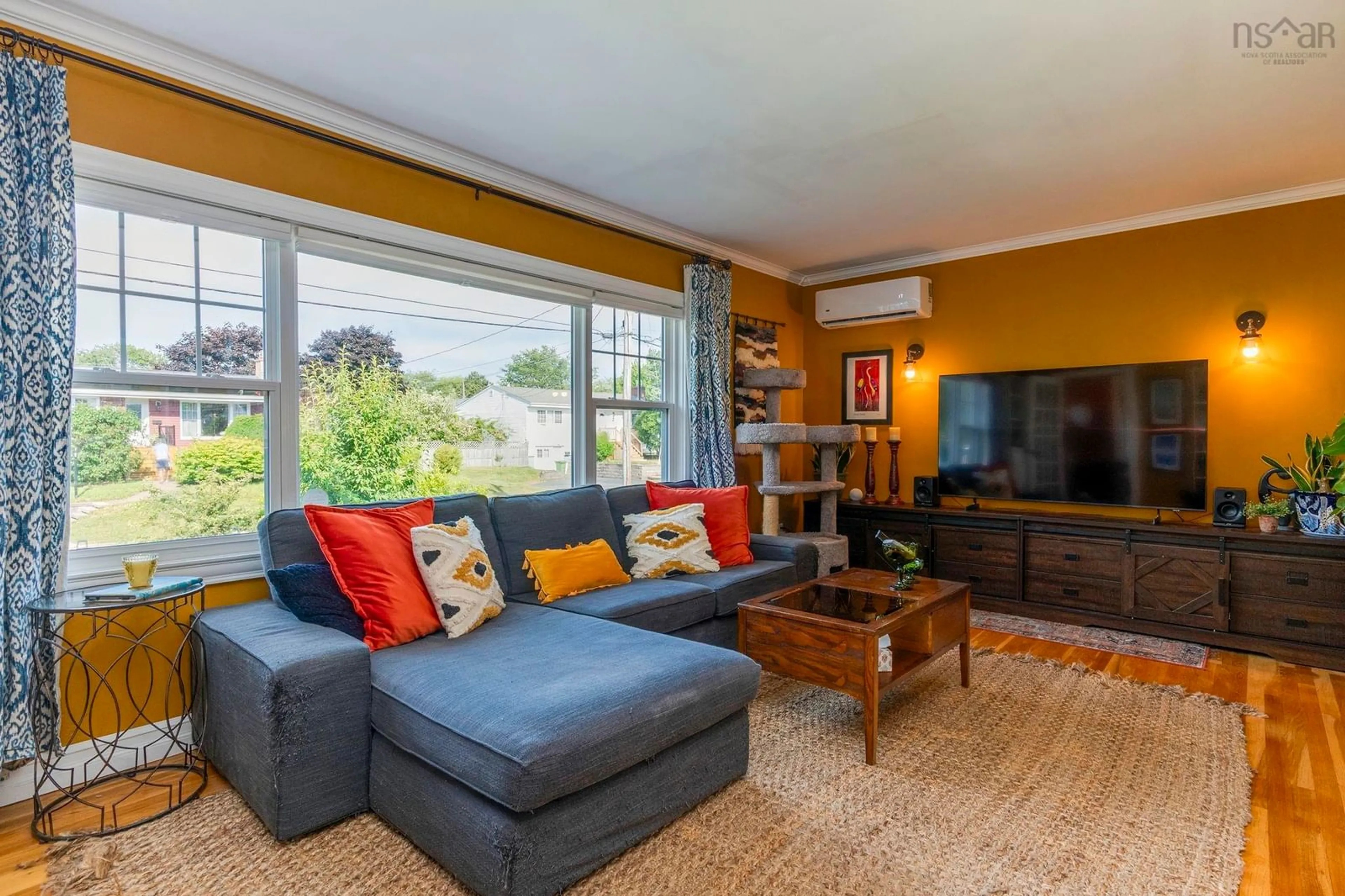 Living room with furniture, wood/laminate floor for 7 Edmond Dr, Woodlawn Nova Scotia B2W 2K1