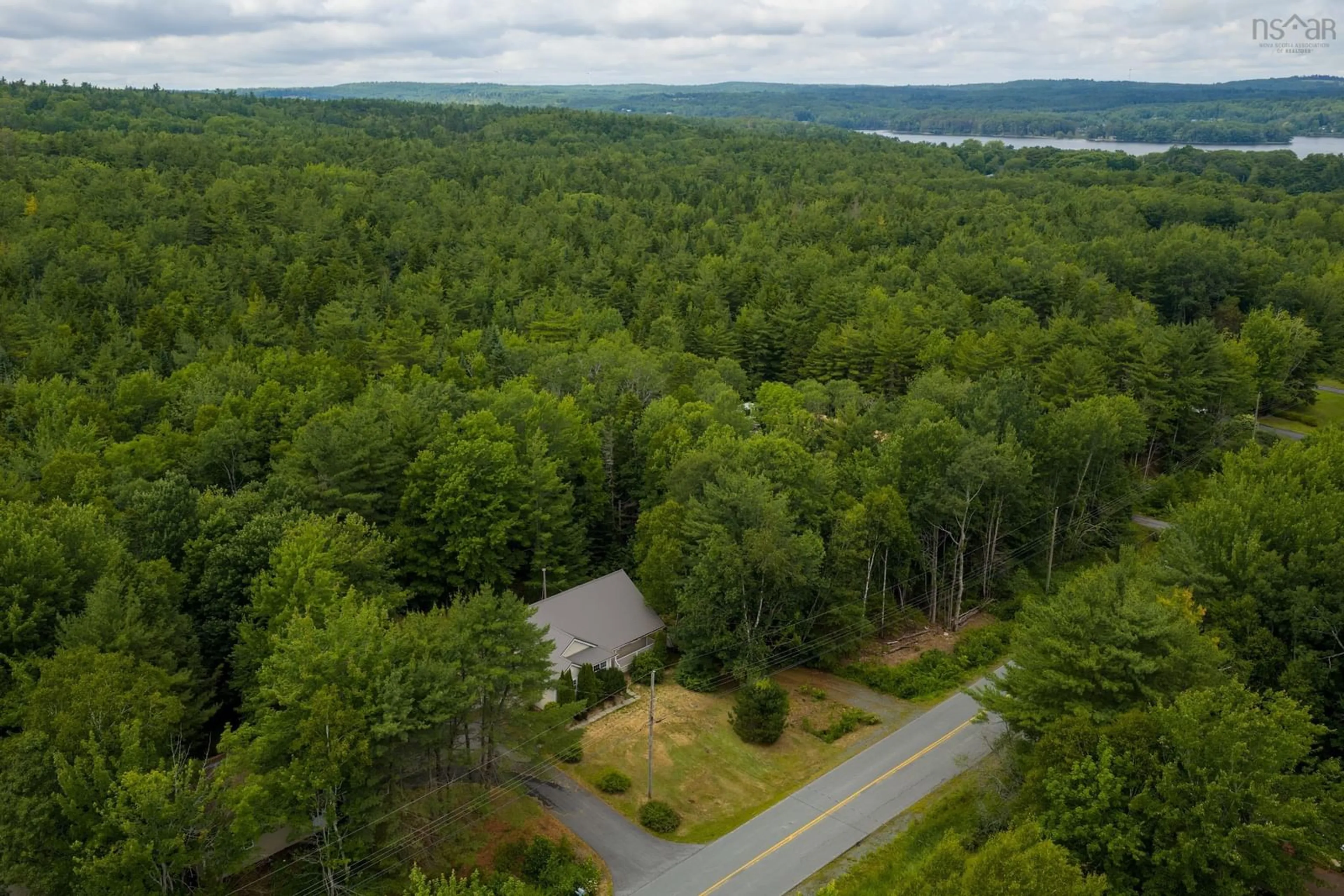 A pic from outside/outdoor area/front of a property/back of a property/a pic from drone, forest/trees view for 104 Bluenose Ave, Pleasantville Nova Scotia B0R 1G0