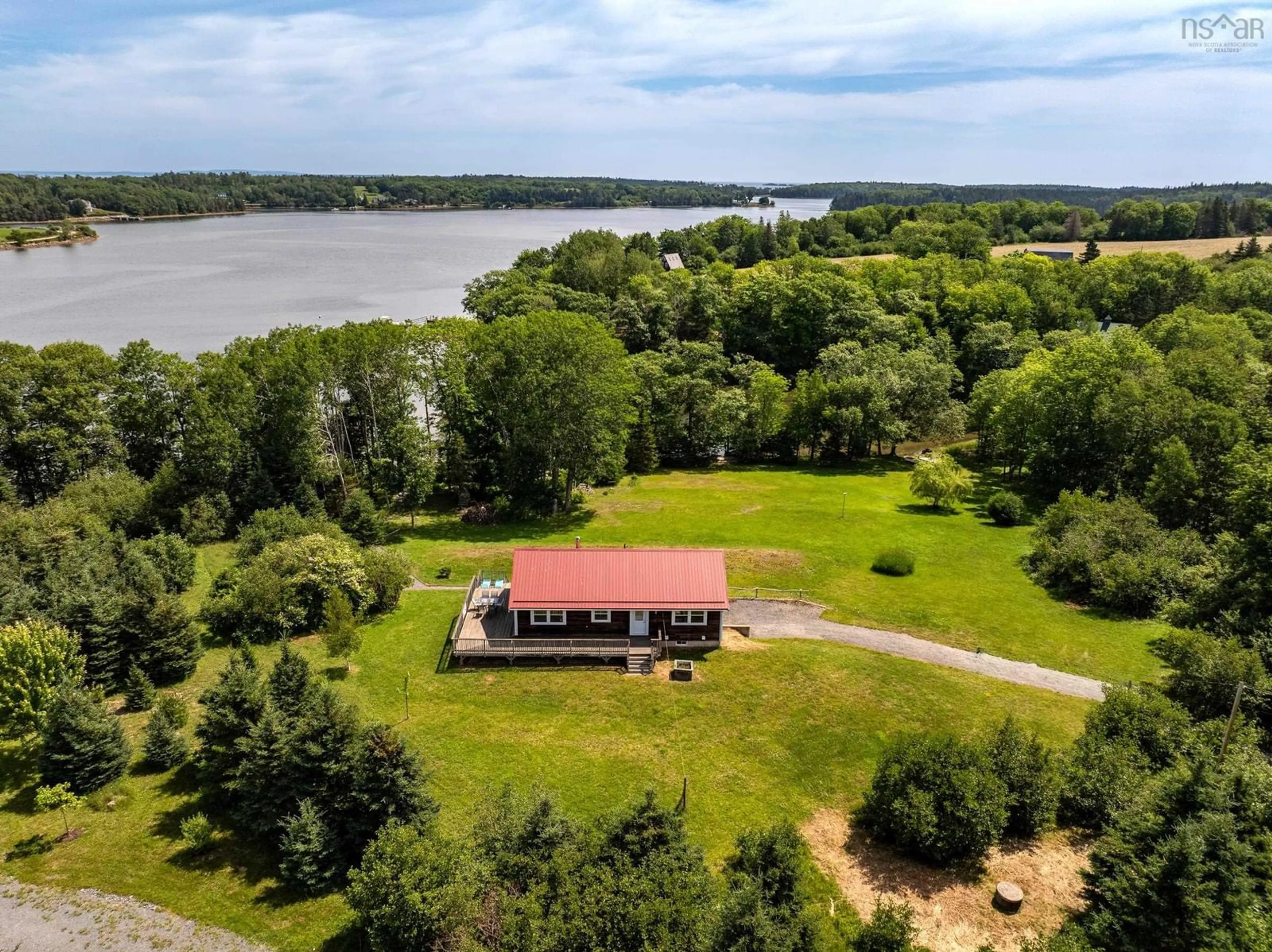 A pic from outside/outdoor area/front of a property/back of a property/a pic from drone, water/lake/river/ocean view for 9 Littlecove Rd, First Peninsula Nova Scotia B0J 2C0