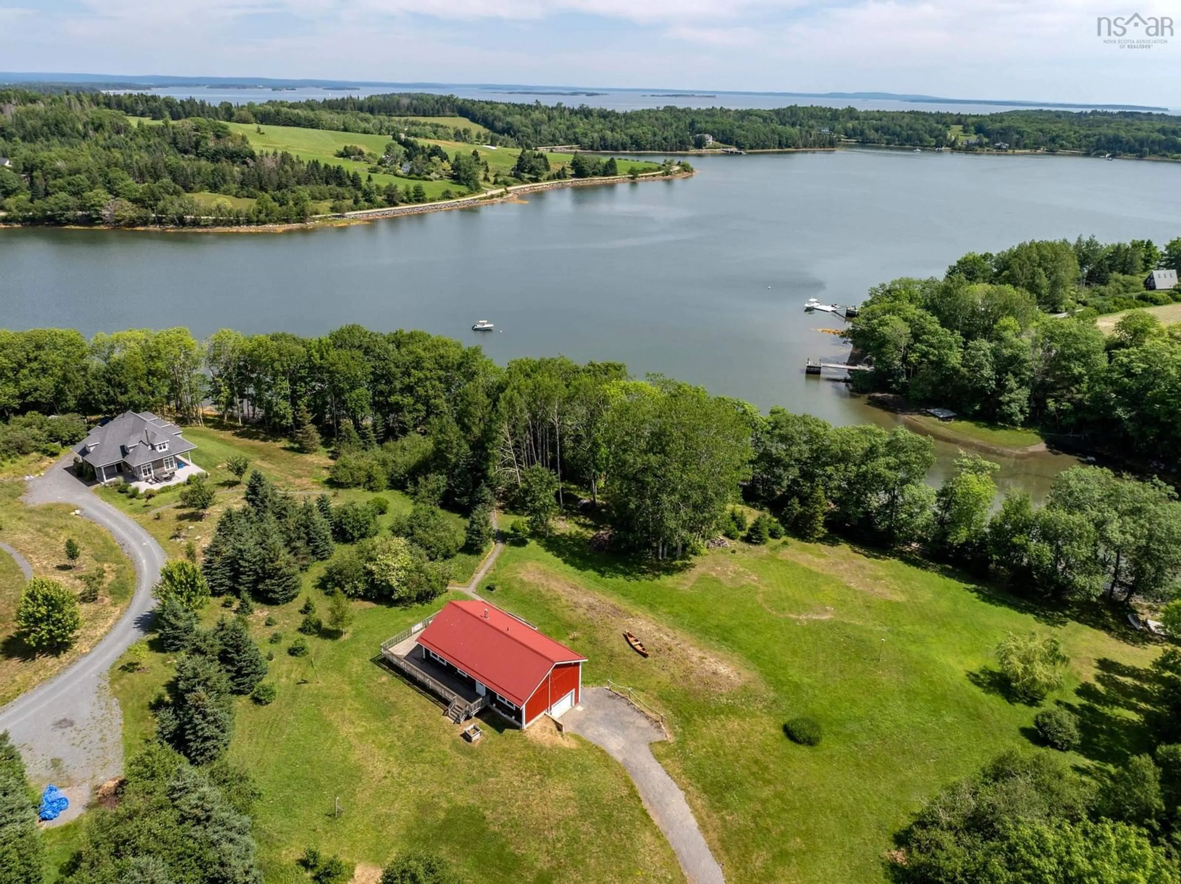 A pic from outside/outdoor area/front of a property/back of a property/a pic from drone, water/lake/river/ocean view for 9 Littlecove Rd, First Peninsula Nova Scotia B0J 2C0