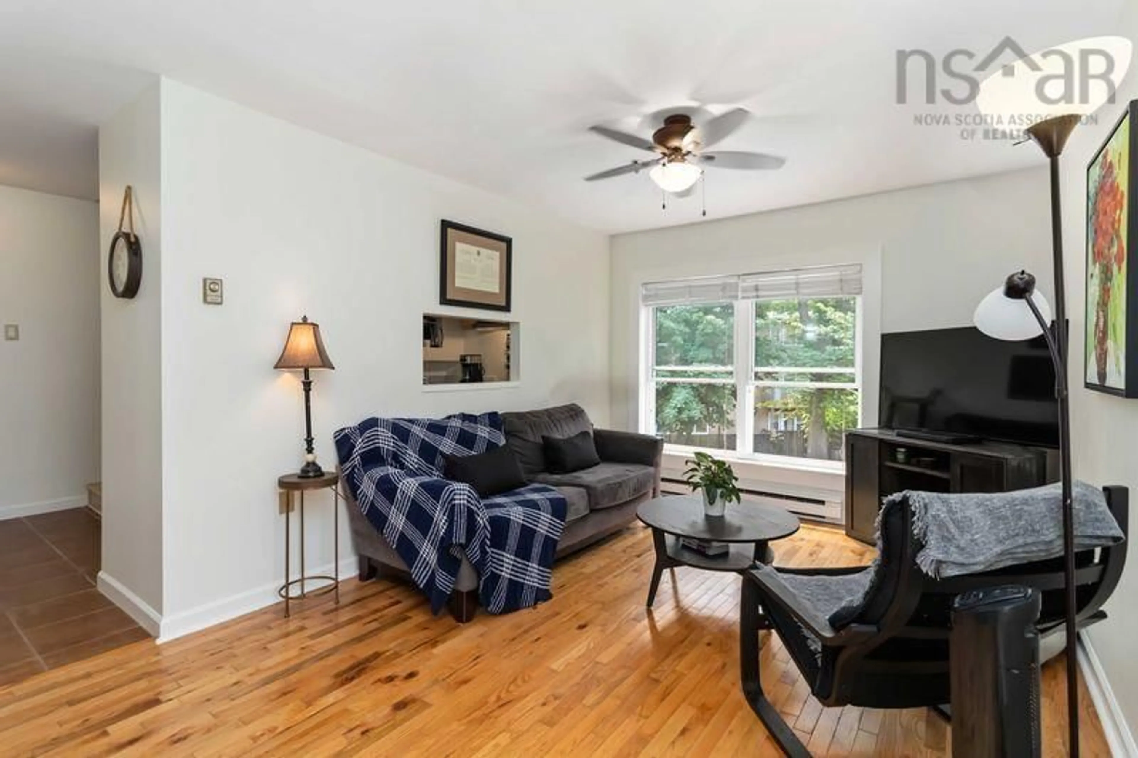 Living room with furniture, wood/laminate floor for 5444 Victoria Rd #12, Halifax Peninsula Nova Scotia B3H 1M5