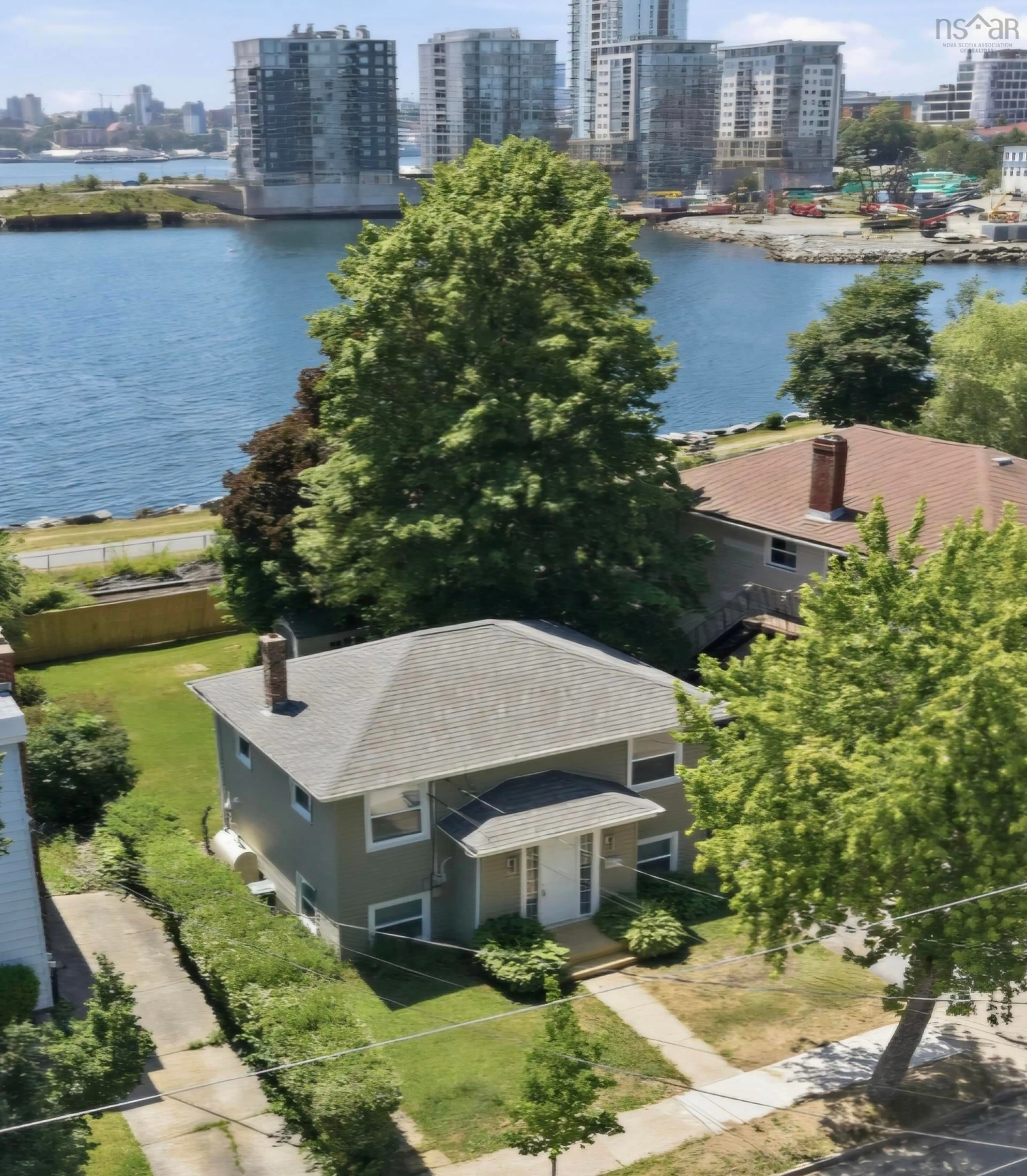 A pic from outside/outdoor area/front of a property/back of a property/a pic from drone, water/lake/river/ocean view for 56 Hazelhurst St, Dartmouth Nova Scotia B2Y 3N2