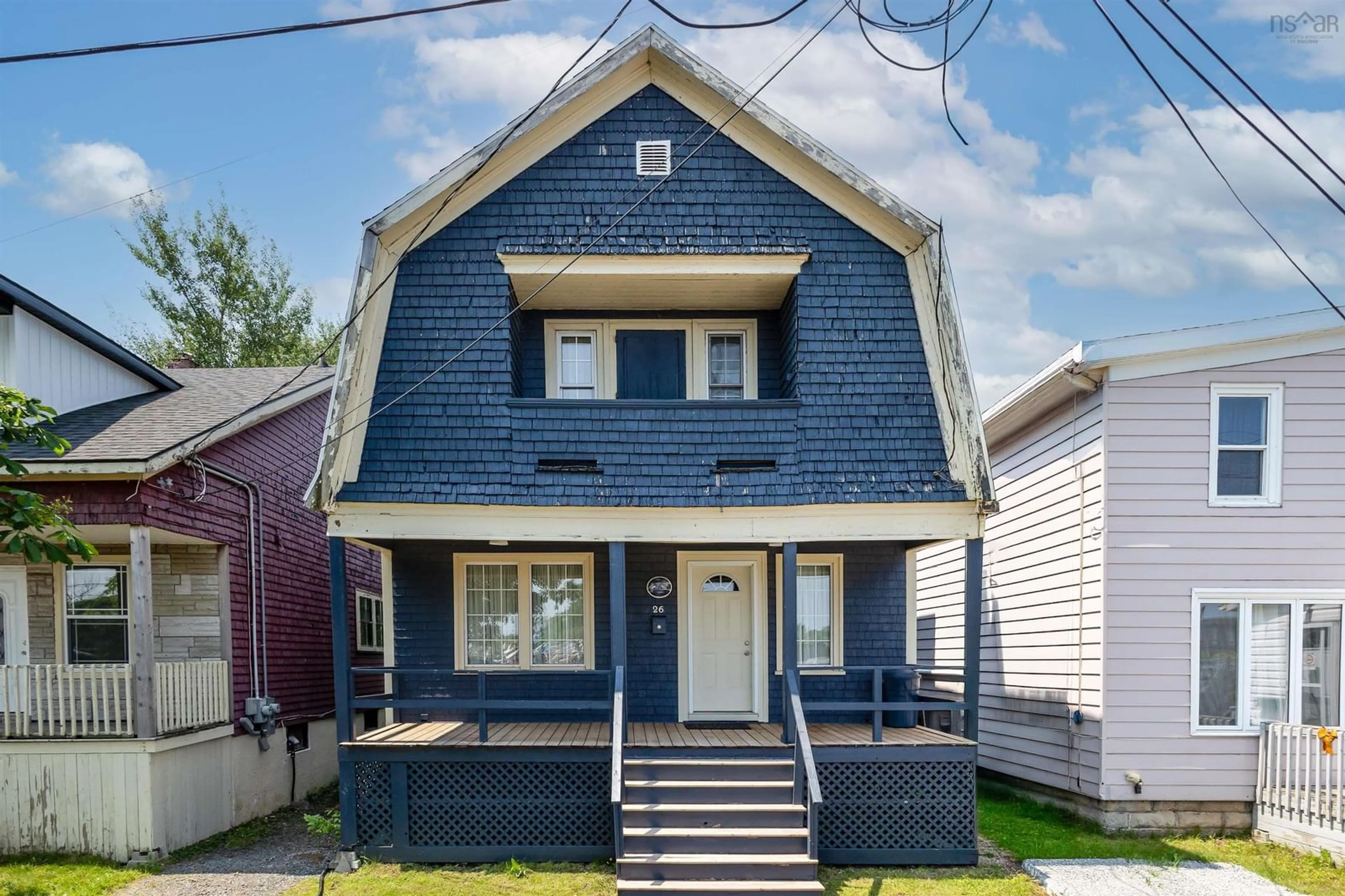 Home with vinyl exterior material, street for 26 Hugh St, Sydney Nova Scotia B1P 1V7