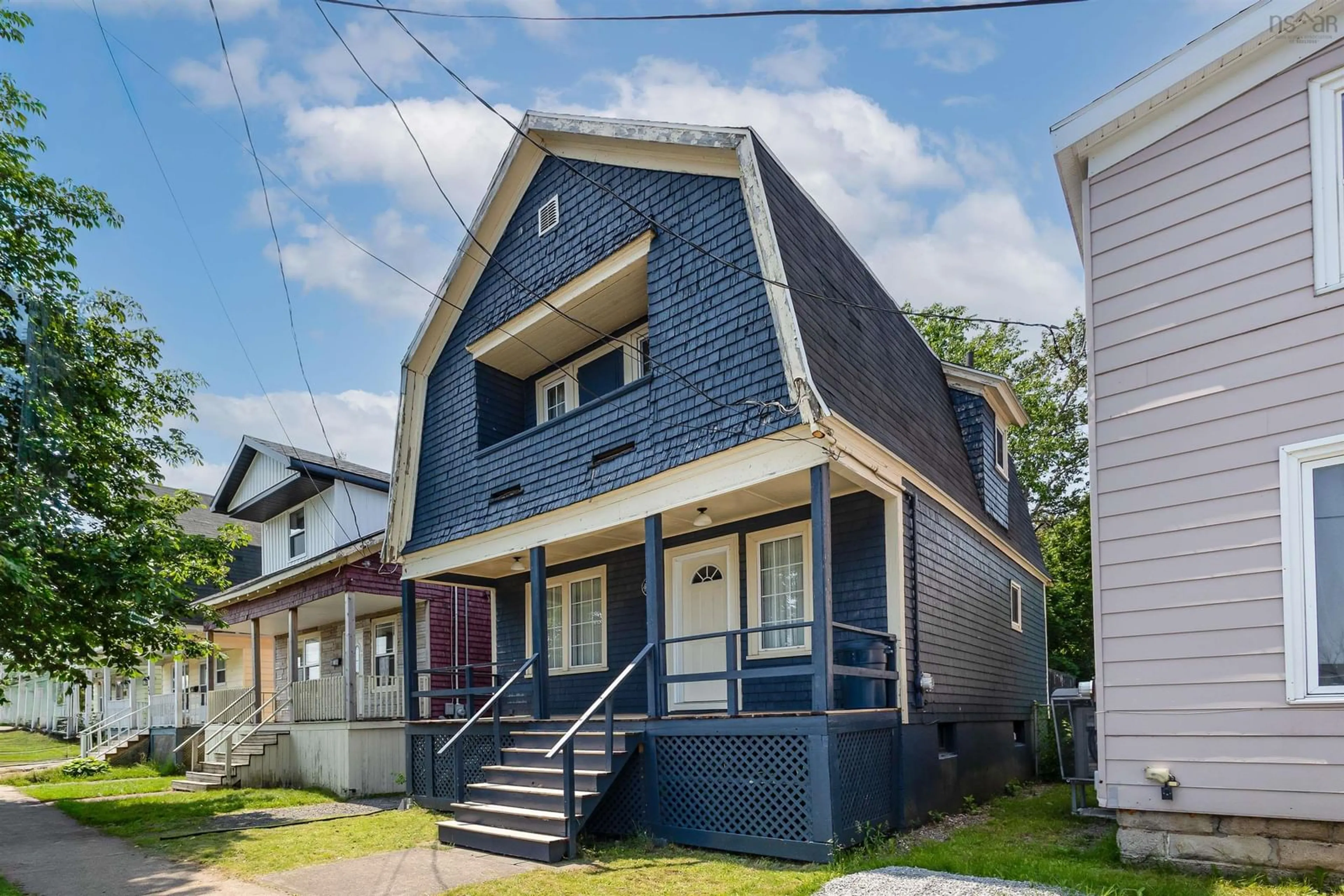 Home with vinyl exterior material, street for 26 Hugh St, Sydney Nova Scotia B1P 1V7