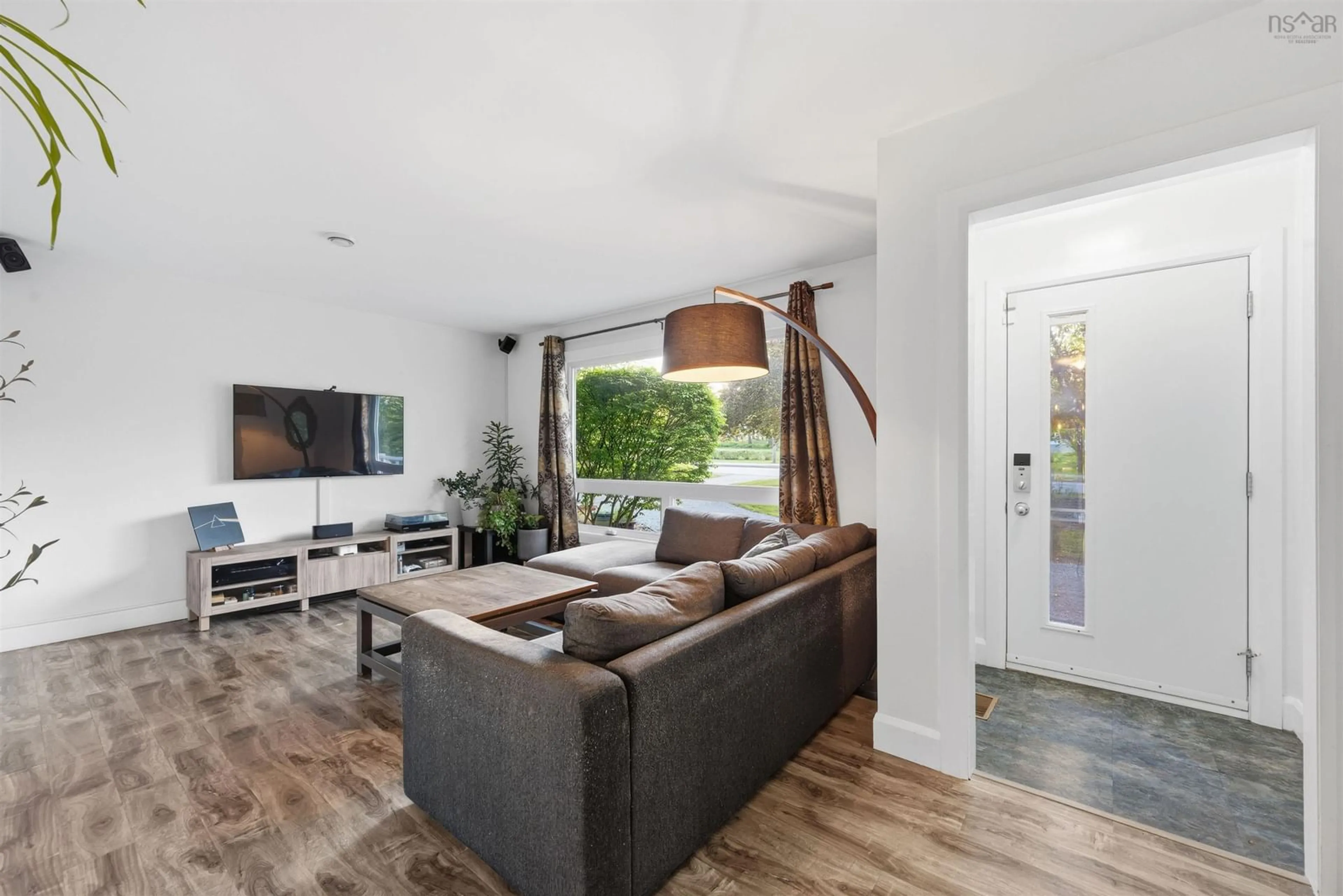 Living room with furniture, wood/laminate floor for 409 Cobequid Rd, Lower Sackville Nova Scotia B4C 3E6