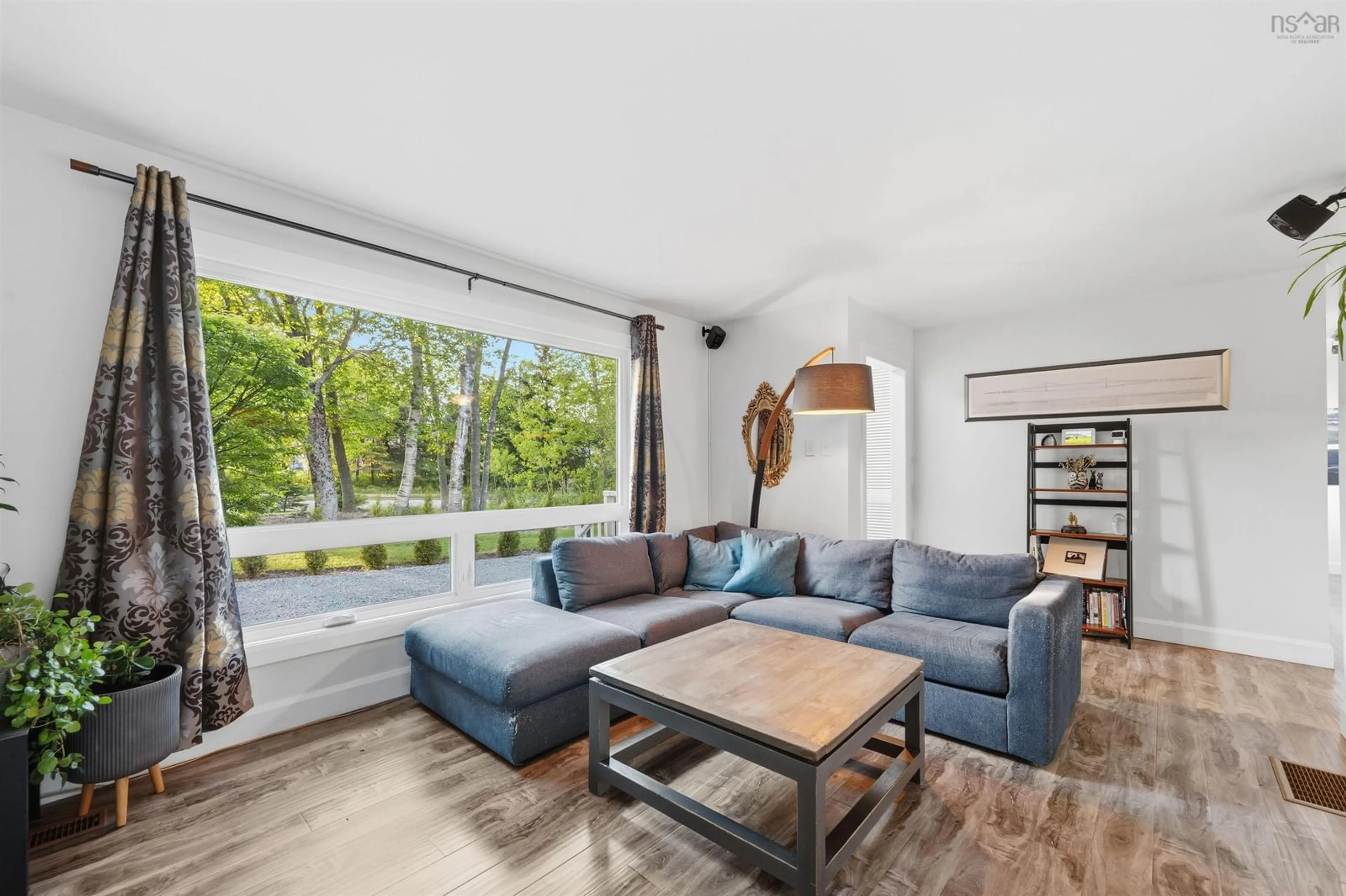 Living room with furniture, wood/laminate floor for 409 Cobequid Rd, Lower Sackville Nova Scotia B4C 3E6