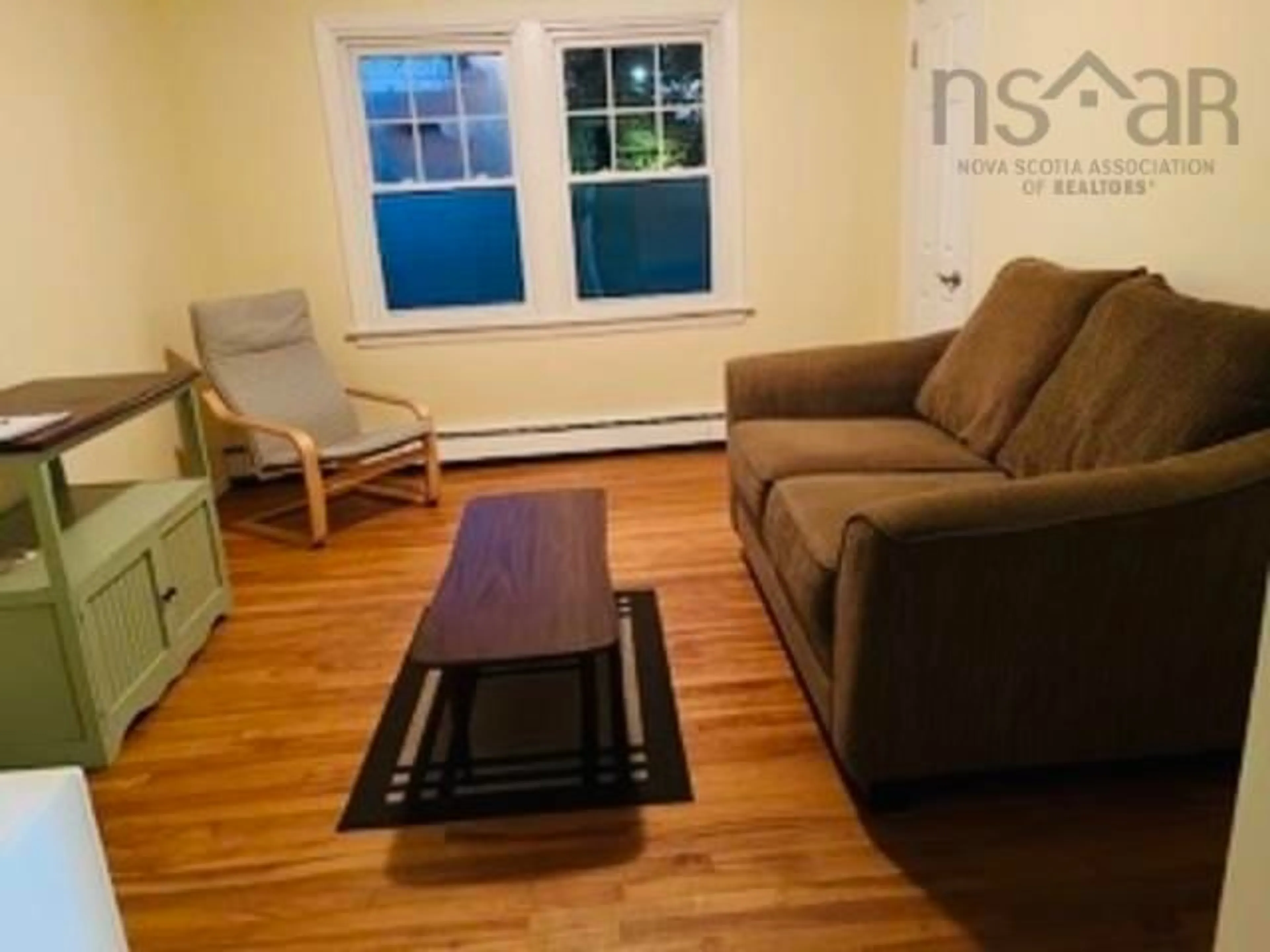Living room with furniture, wood/laminate floor for 2167-2175 Windsor St, Halifax Nova Scotia B3K 5B7