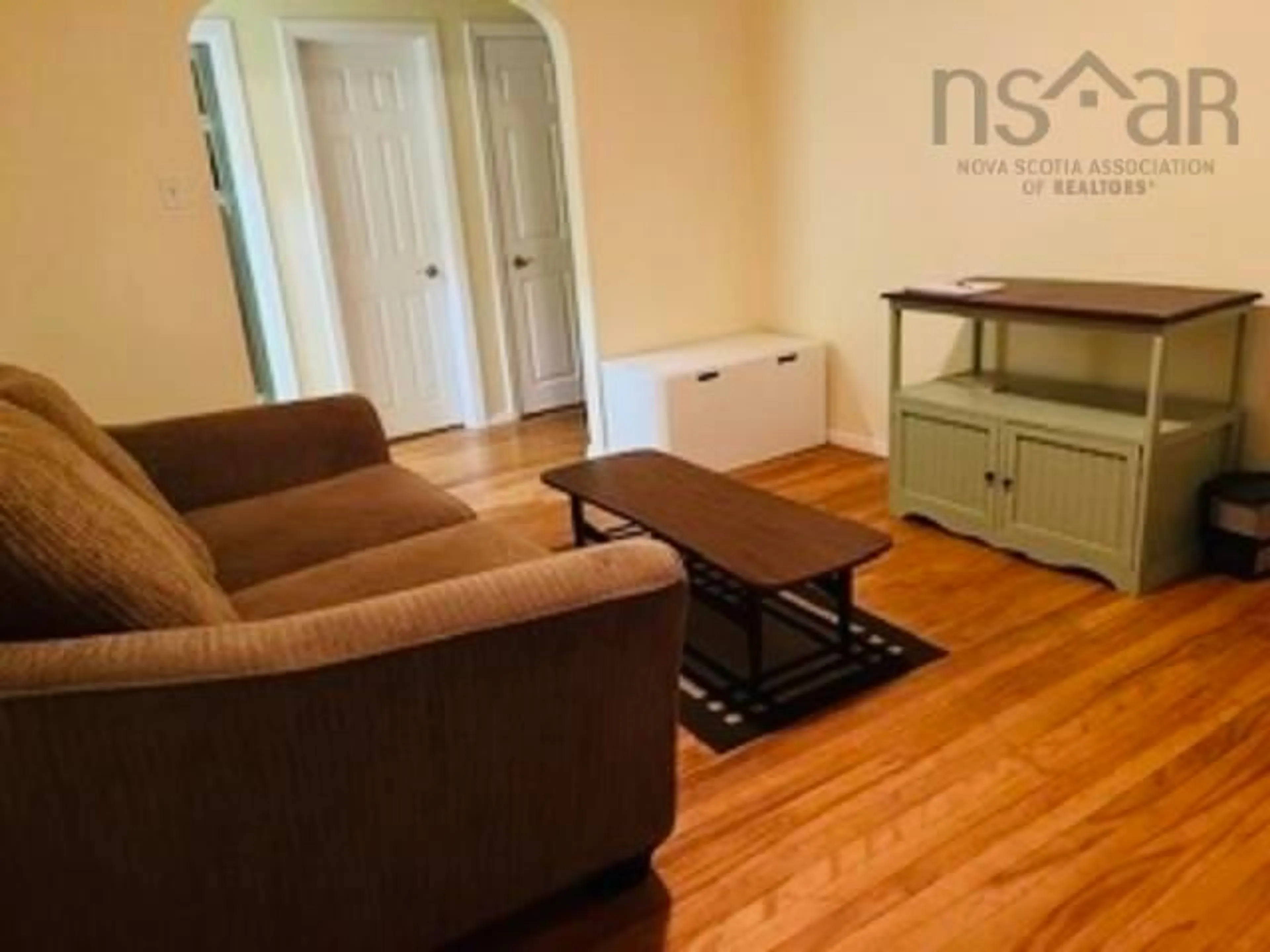 Living room with furniture, wood/laminate floor for 2167-2175 Windsor St, Halifax Nova Scotia B3K 5B7
