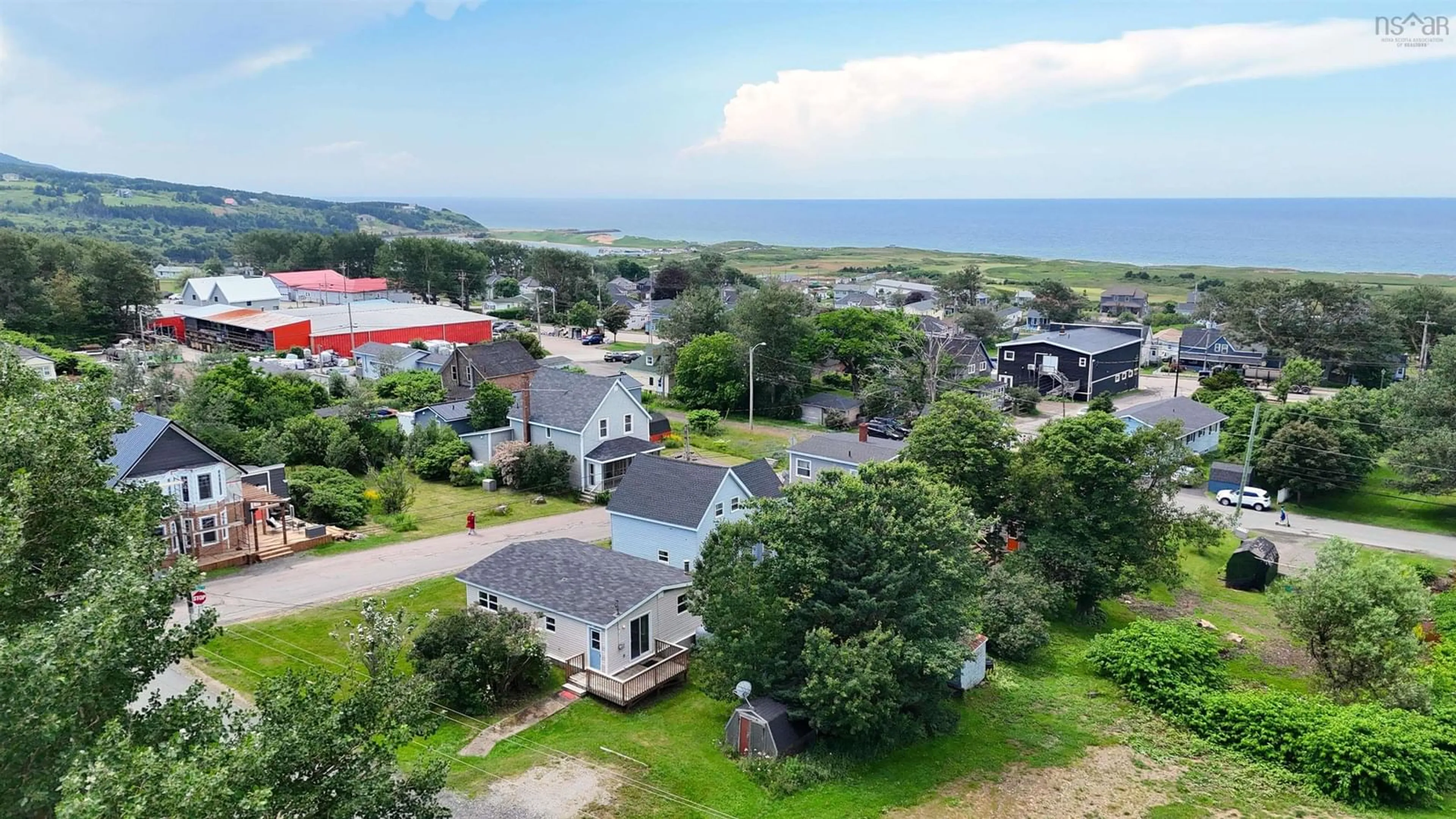 A pic from outside/outdoor area/front of a property/back of a property/a pic from drone, water/lake/river/ocean view for 87 Church St, Inverness Nova Scotia B0E 1N0