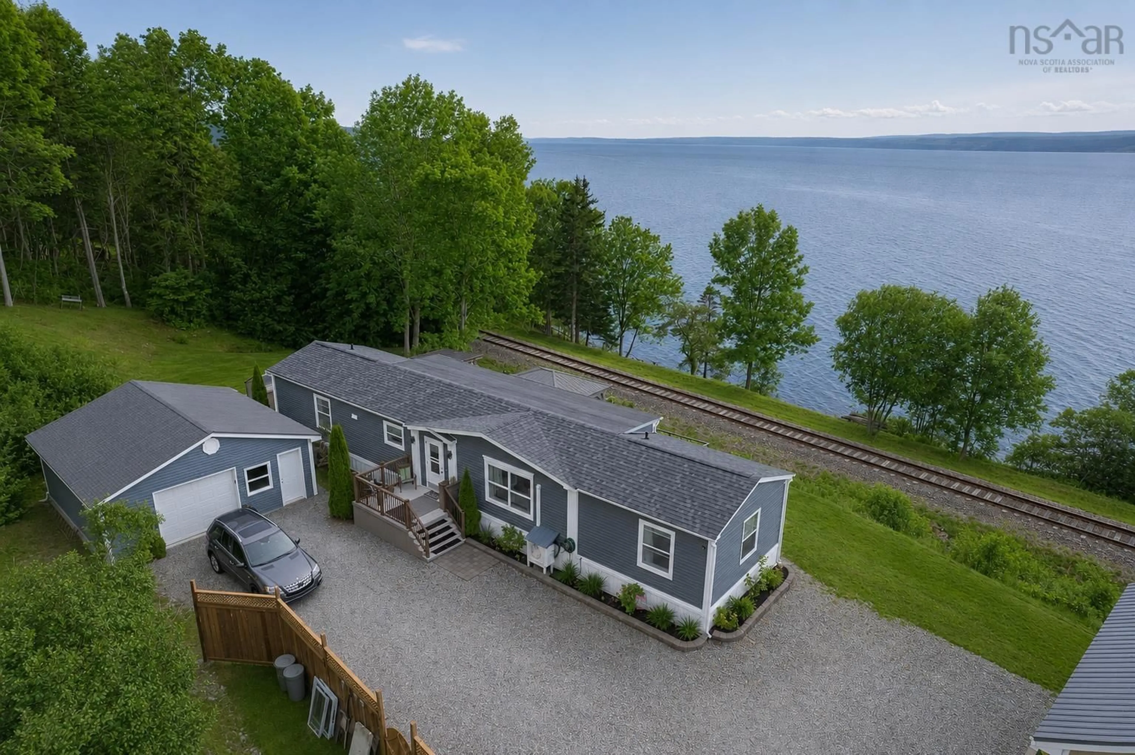 A pic from outside/outdoor area/front of a property/back of a property/a pic from drone, water/lake/river/ocean view for 3500 Long Island Rd, Long Island Nova Scotia B1Y 3N2