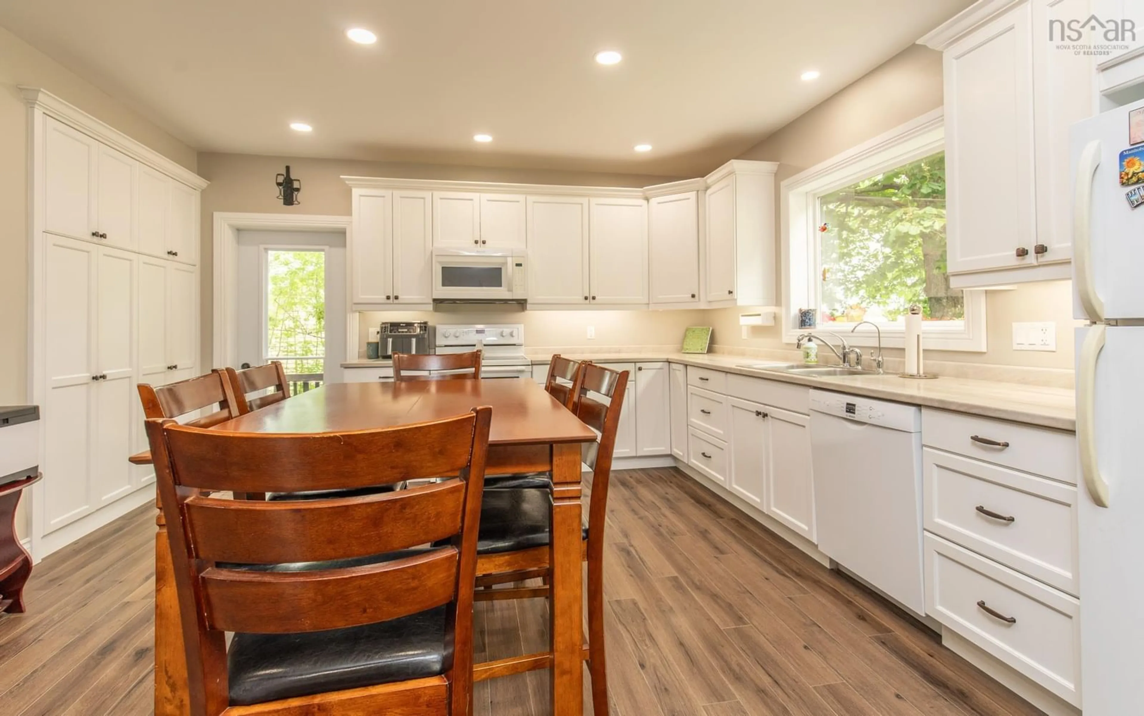 Open concept kitchen, wood/laminate floor for 223-225 Forest St, Yarmouth Nova Scotia B5A 5H4