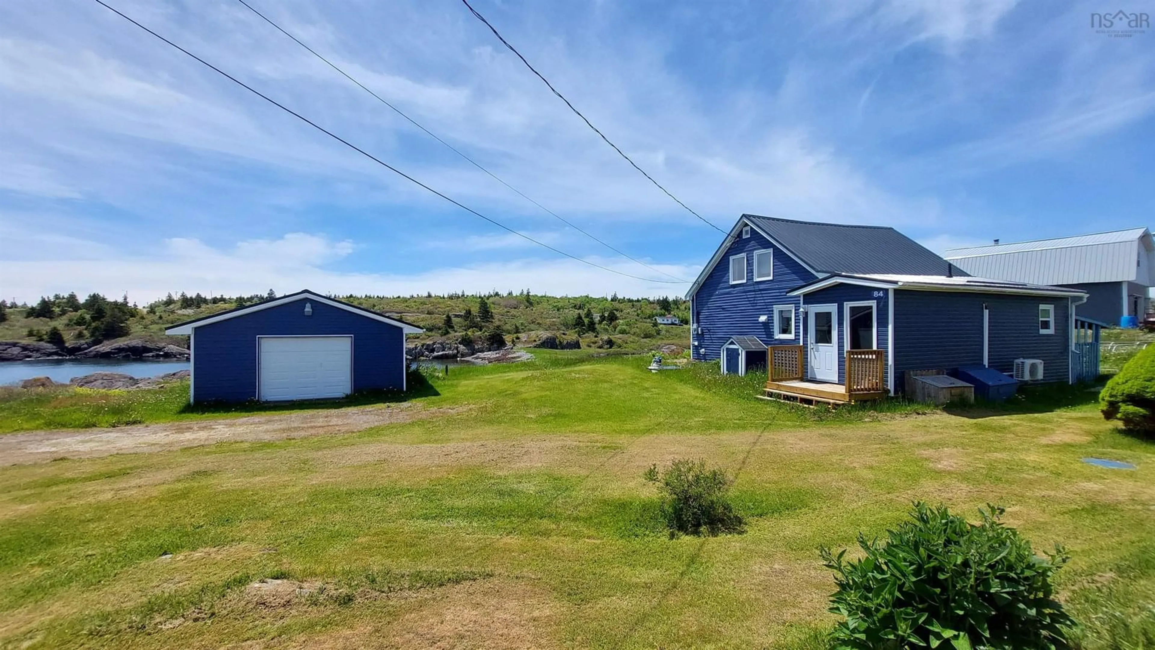 A pic from outside/outdoor area/front of a property/back of a property/a pic from drone, unknown for 84 Highway 206, Sampsons Cove Nova Scotia B0E 2L0