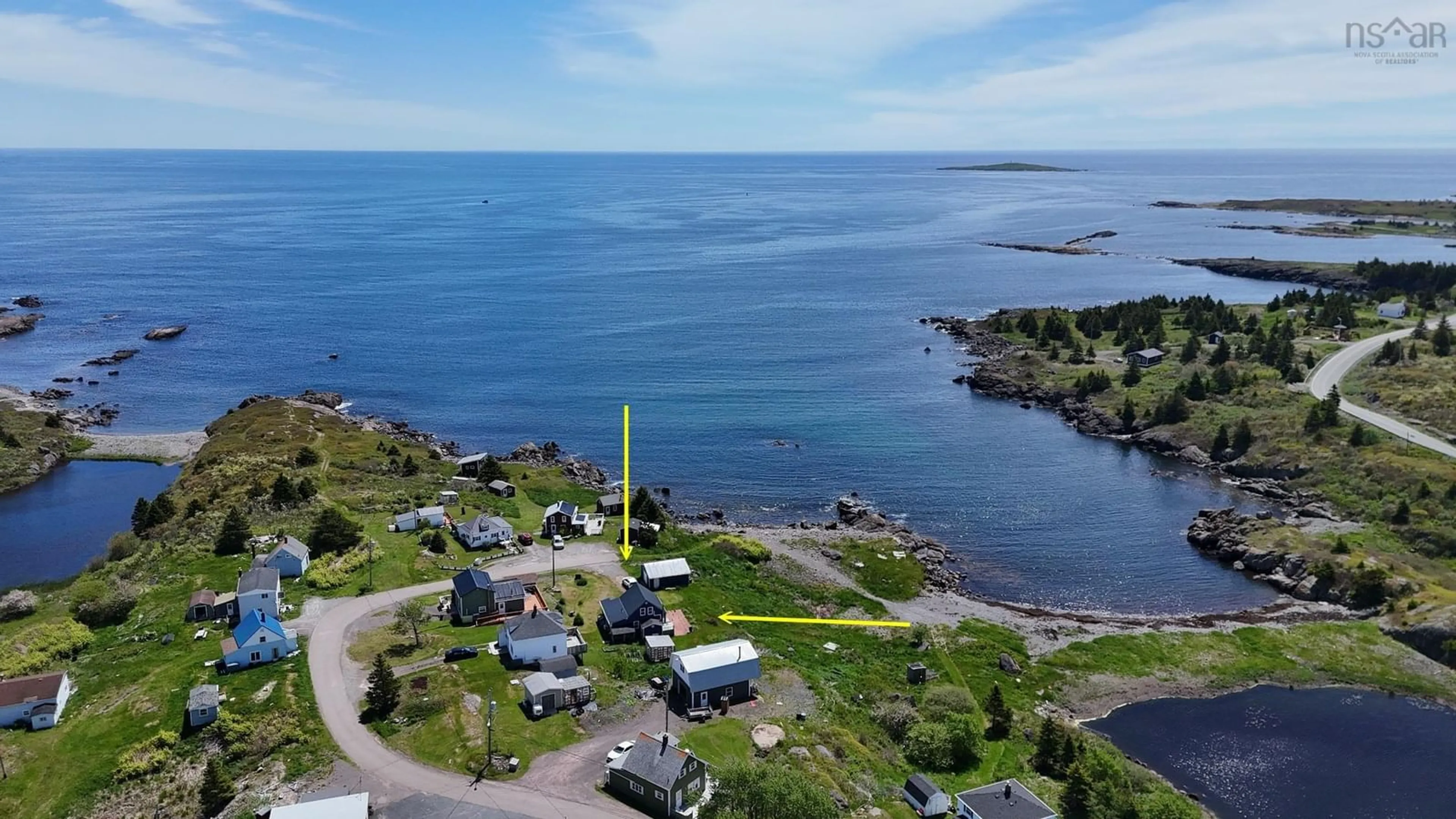 A pic from outside/outdoor area/front of a property/back of a property/a pic from drone, water/lake/river/ocean view for 84 Highway 206, Sampsons Cove Nova Scotia B0E 2L0
