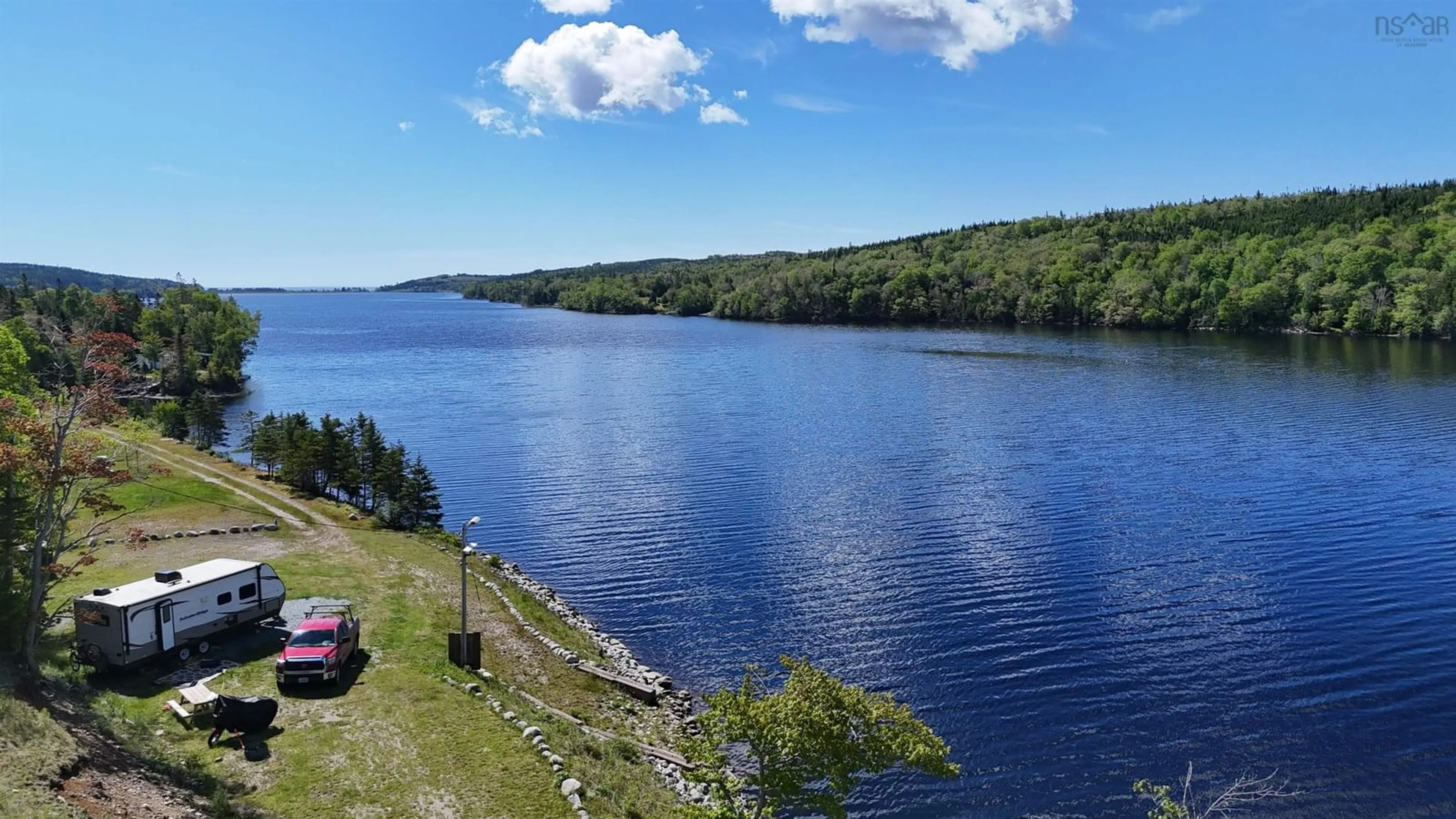 A pic from outside/outdoor area/front of a property/back of a property/a pic from drone, water/lake/river/ocean view for 2100 Highway 211, Indian Harbour Lake Nova Scotia B0J 3C0