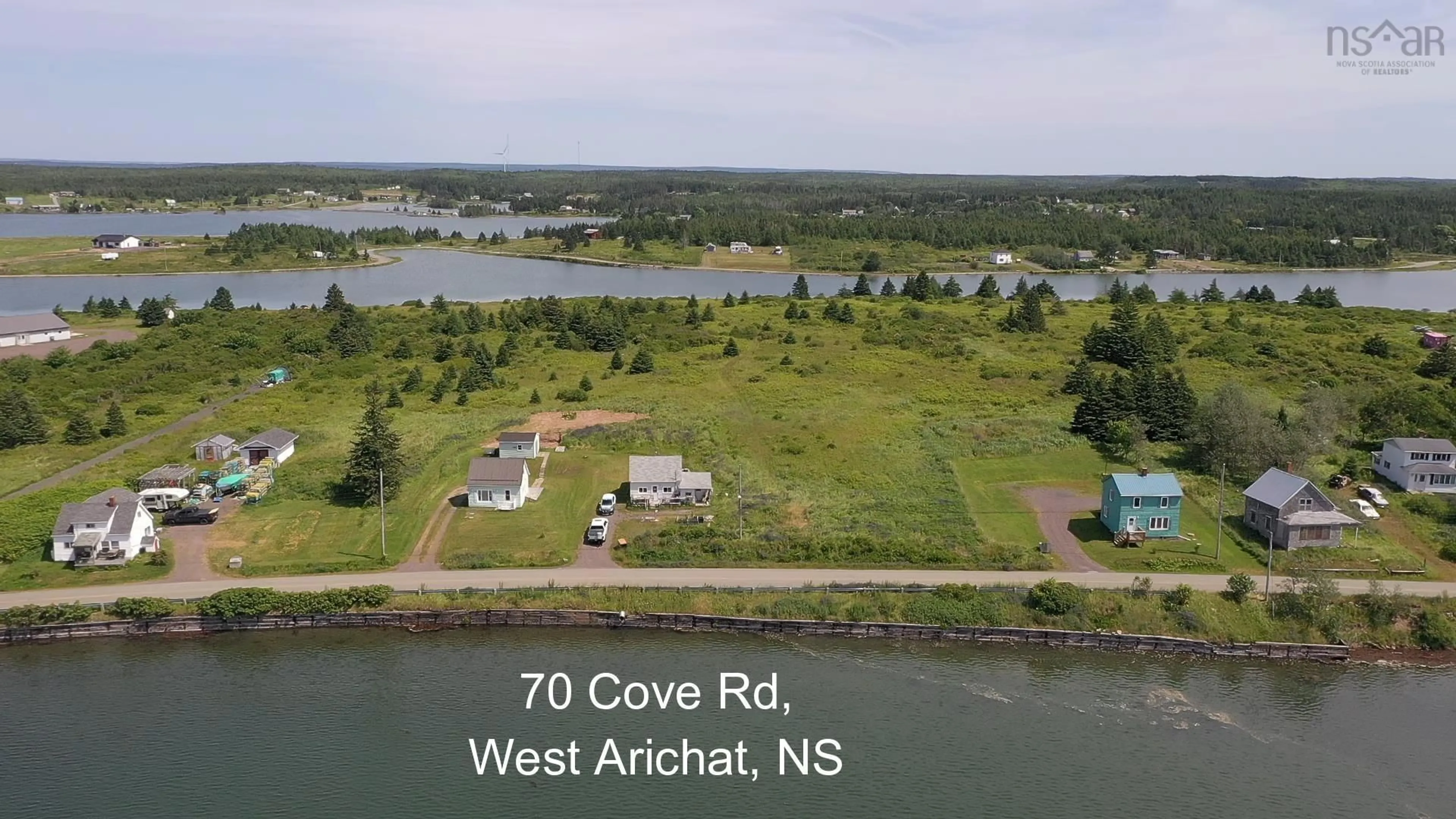 A pic from outside/outdoor area/front of a property/back of a property/a pic from drone, water/lake/river/ocean view for 70 Cove Rd, West Arichat Nova Scotia B0E 3J0