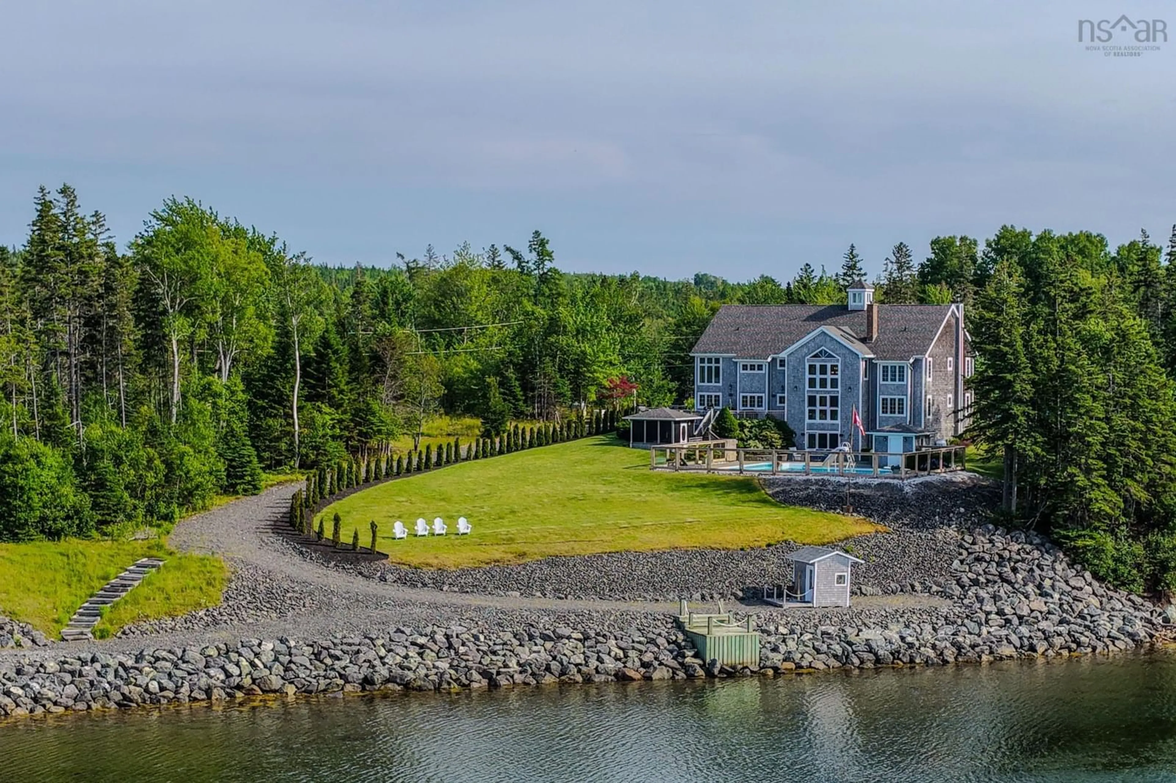 A pic from outside/outdoor area/front of a property/back of a property/a pic from drone, water/lake/river/ocean view for 3190 Point Edward Hwy, Balls Creek Nova Scotia B2A 4P5