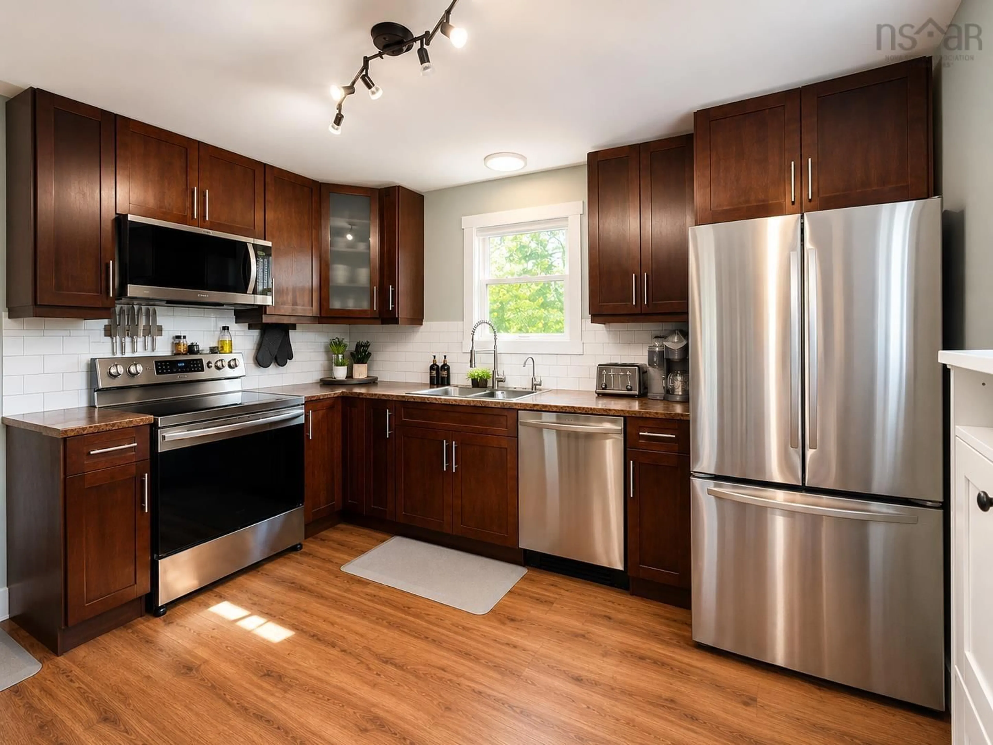 Open concept kitchen, wood/laminate floor for 364 Queen St, Truro Nova Scotia B2N 2C3