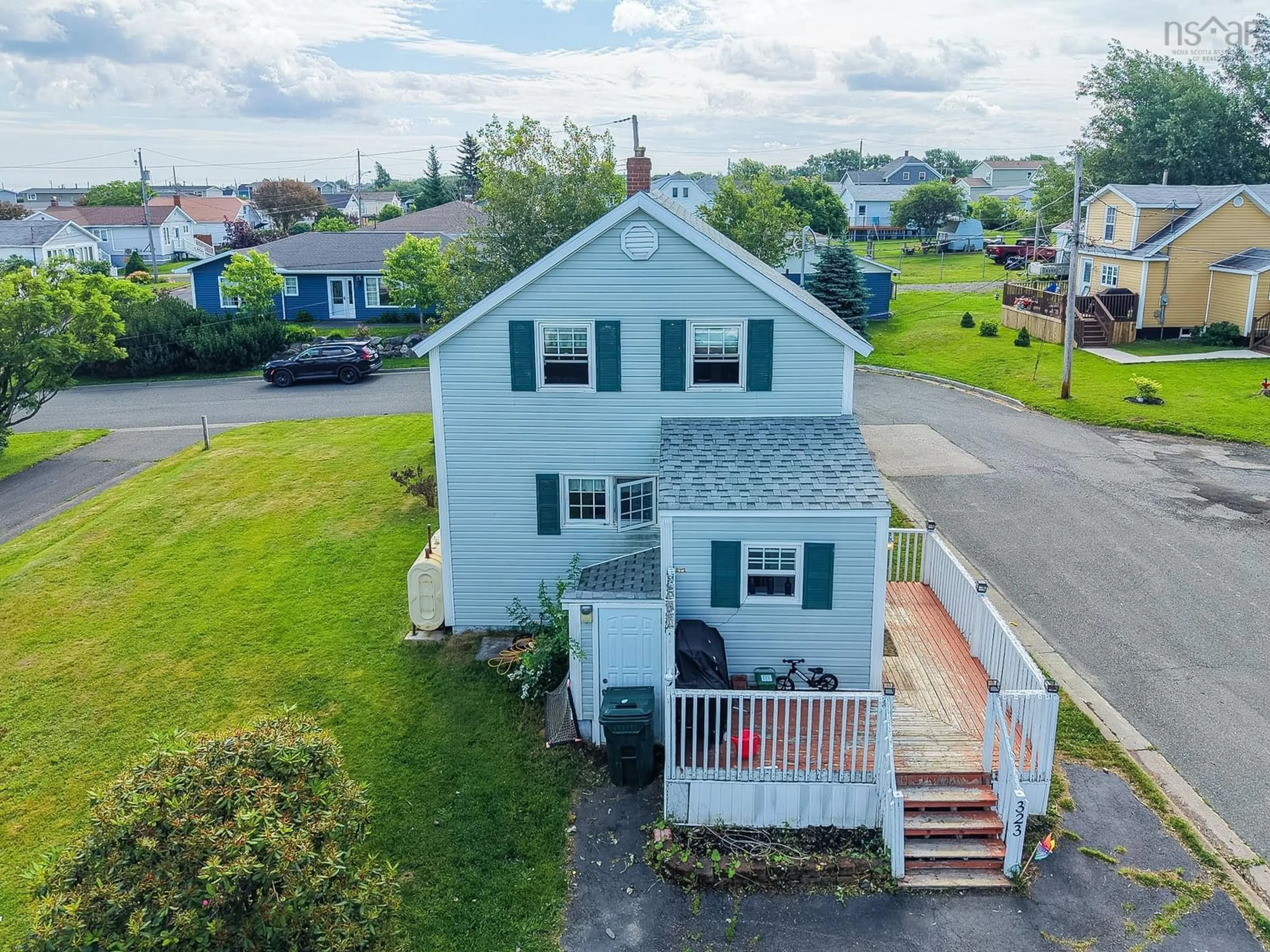 A pic from outside/outdoor area/front of a property/back of a property/a pic from drone, unknown for 323 Patrick St, New Waterford Nova Scotia B1H 3M8