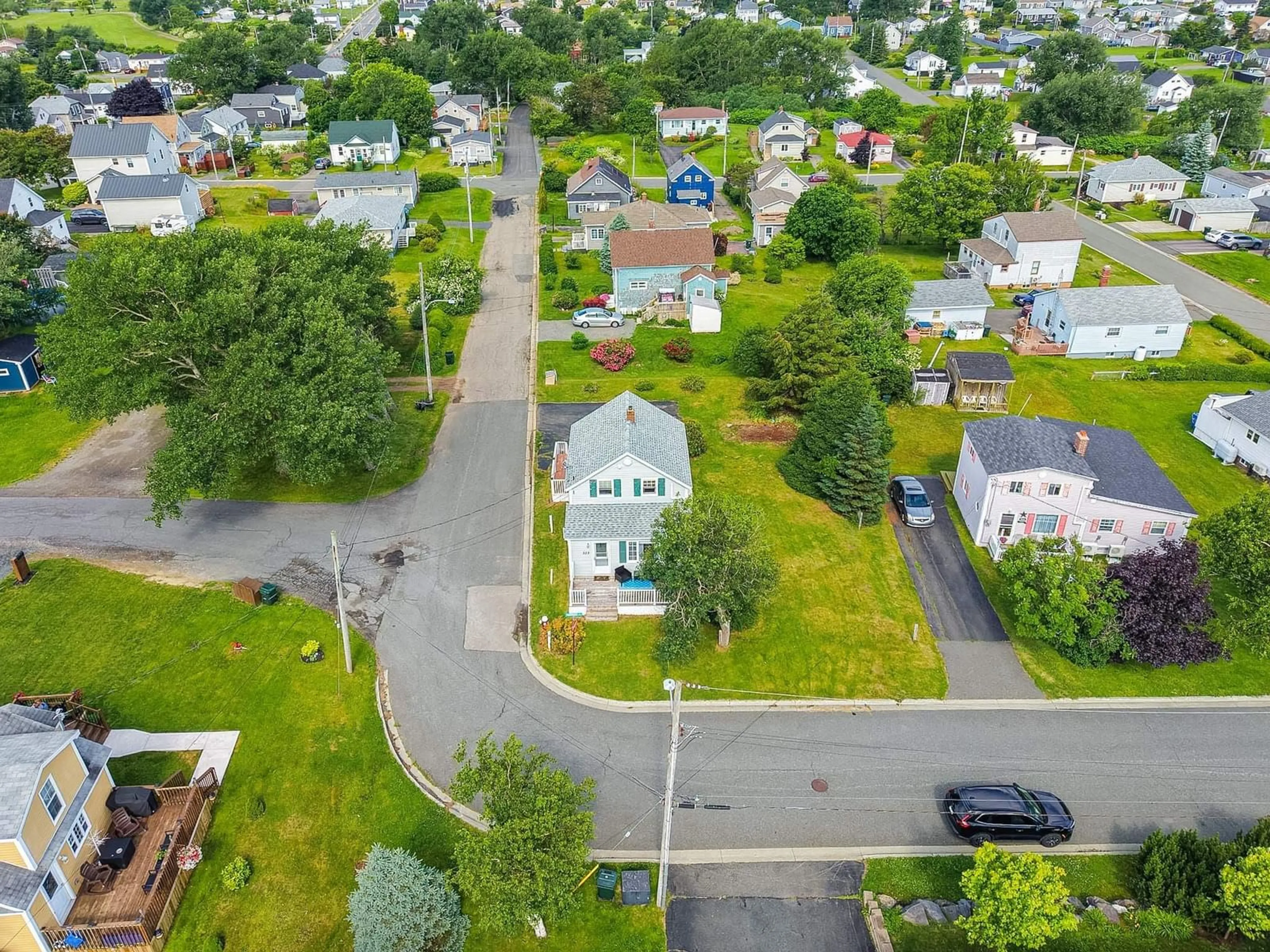 A pic from outside/outdoor area/front of a property/back of a property/a pic from drone, street for 323 Patrick St, New Waterford Nova Scotia B1H 3M8