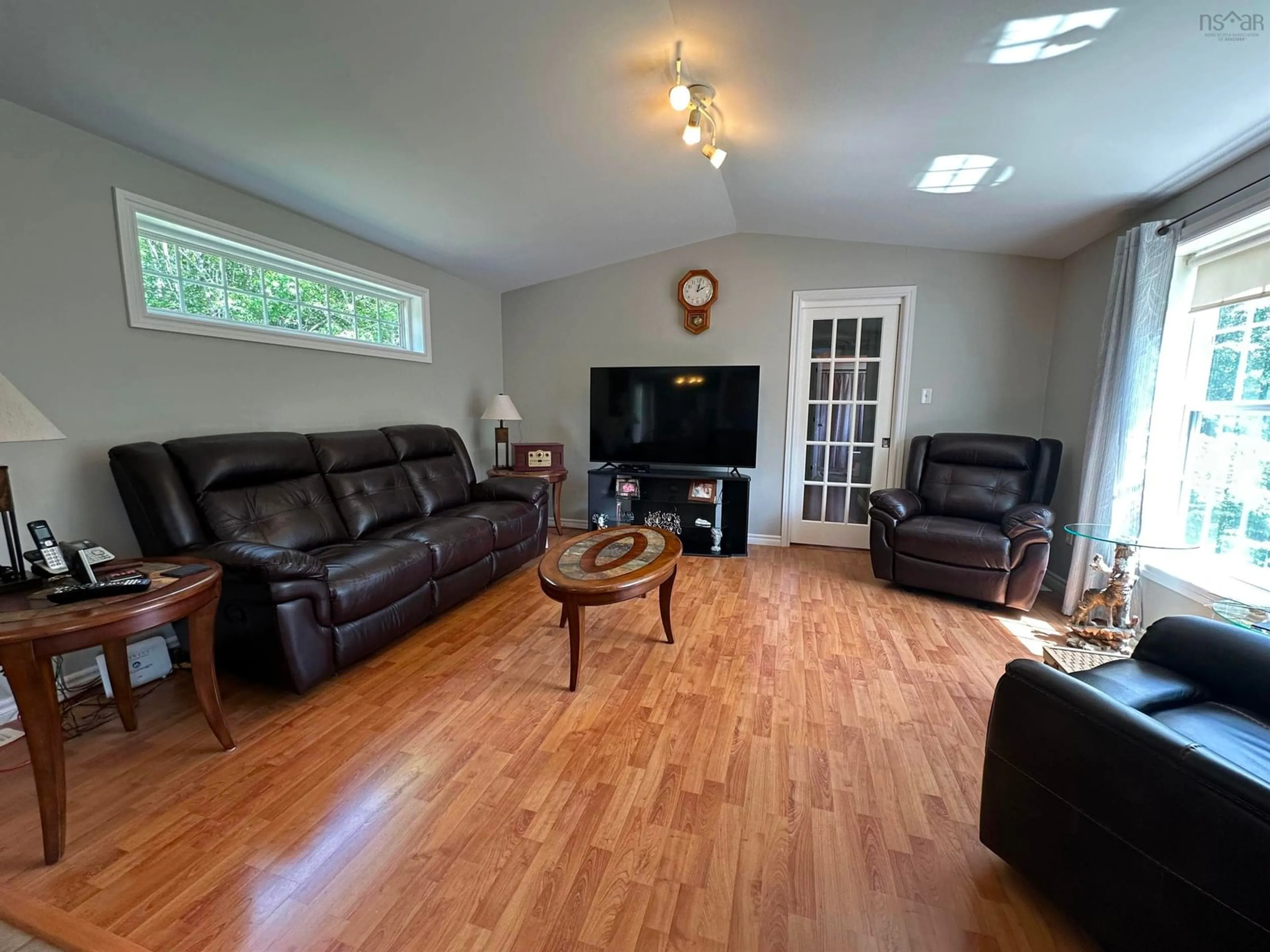 Living room with furniture, wood/laminate floor for 1475 Stewiacke Rd, West St. Andrews Nova Scotia B0N 2J0
