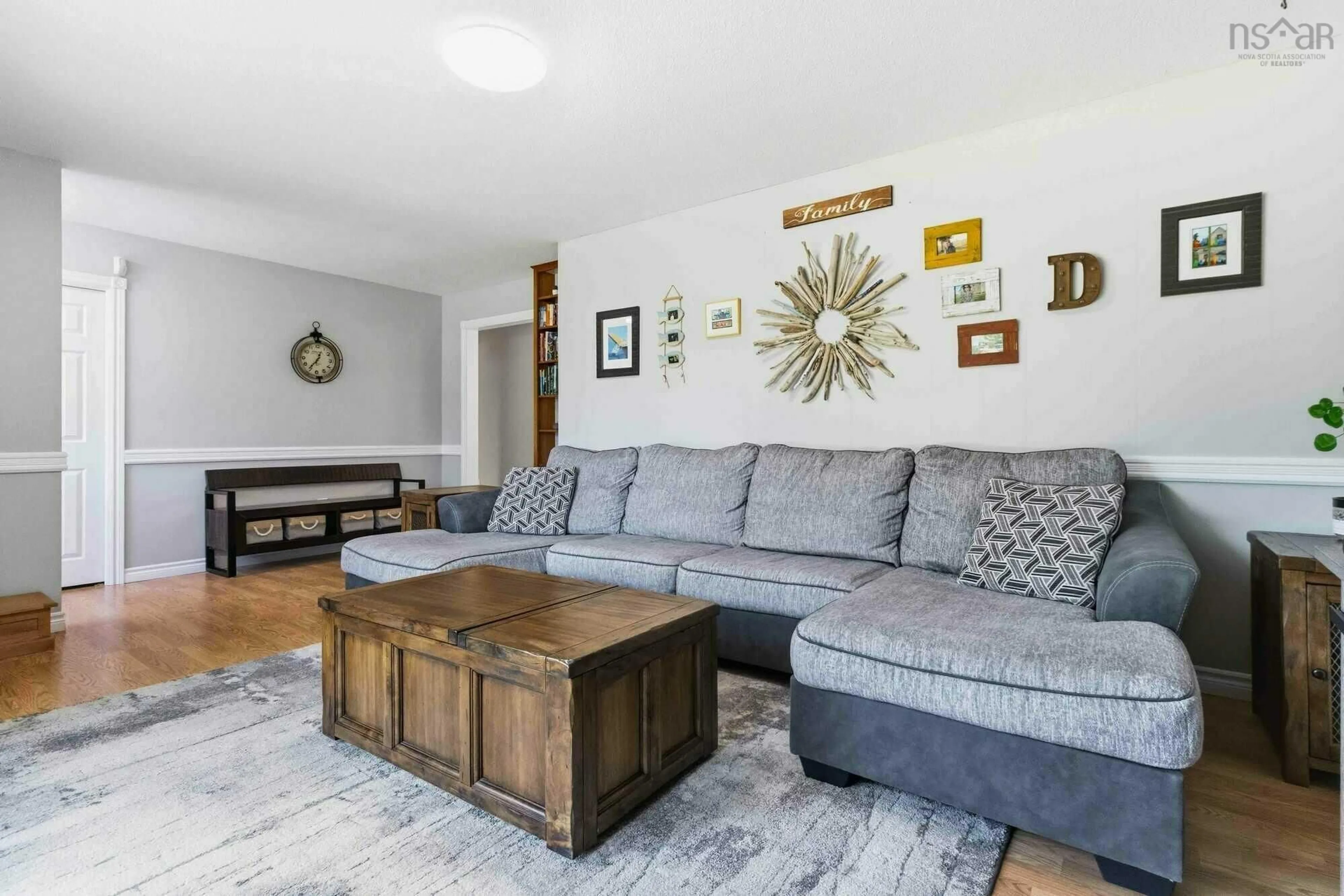 Living room with furniture, wood/laminate floor for 1752 Barss Corner Rd, Scarsdale Nova Scotia B0R 1A0