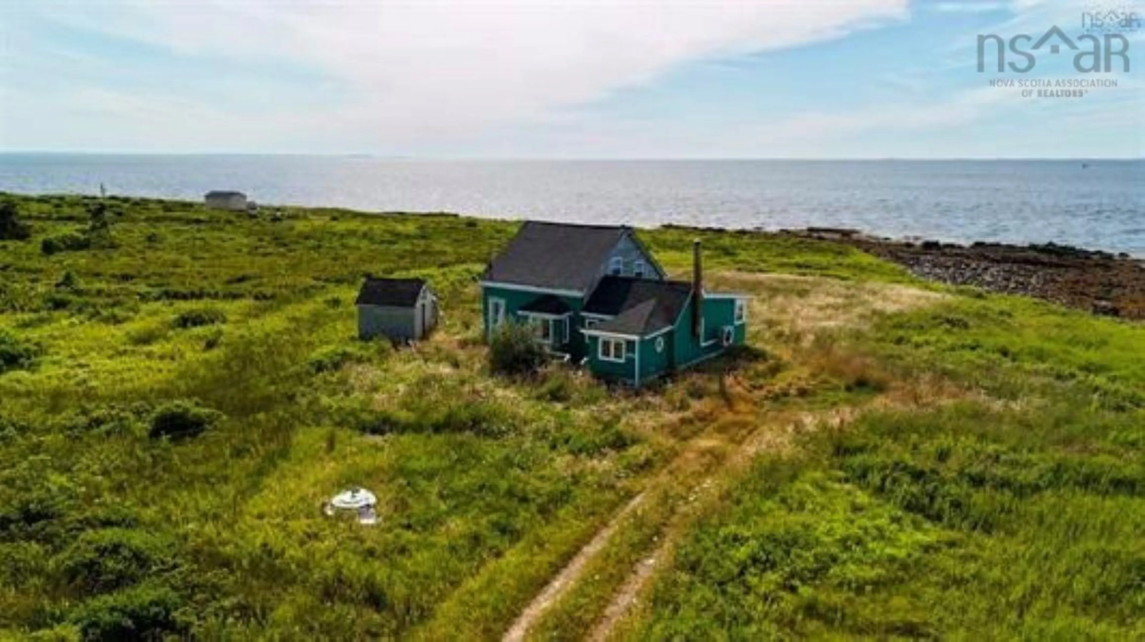 A pic from outside/outdoor area/front of a property/back of a property/a pic from drone, water/lake/river/ocean view for 8581 Highway 3, Charlesville Nova Scotia B0W 2A0