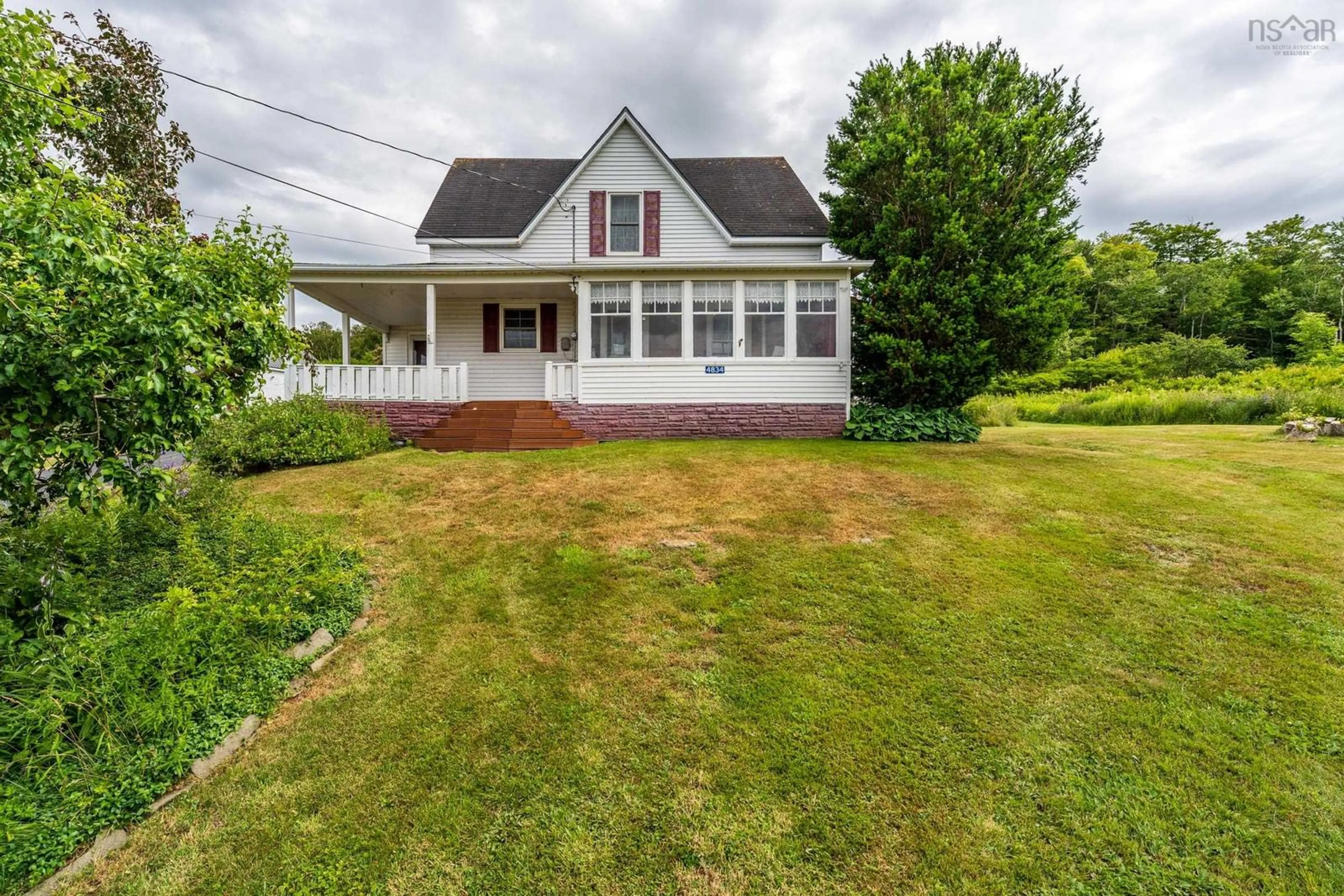 A pic from outside/outdoor area/front of a property/back of a property/a pic from drone, street for 4834 Shore Rd, Parkers Cove Nova Scotia B0S 1A0