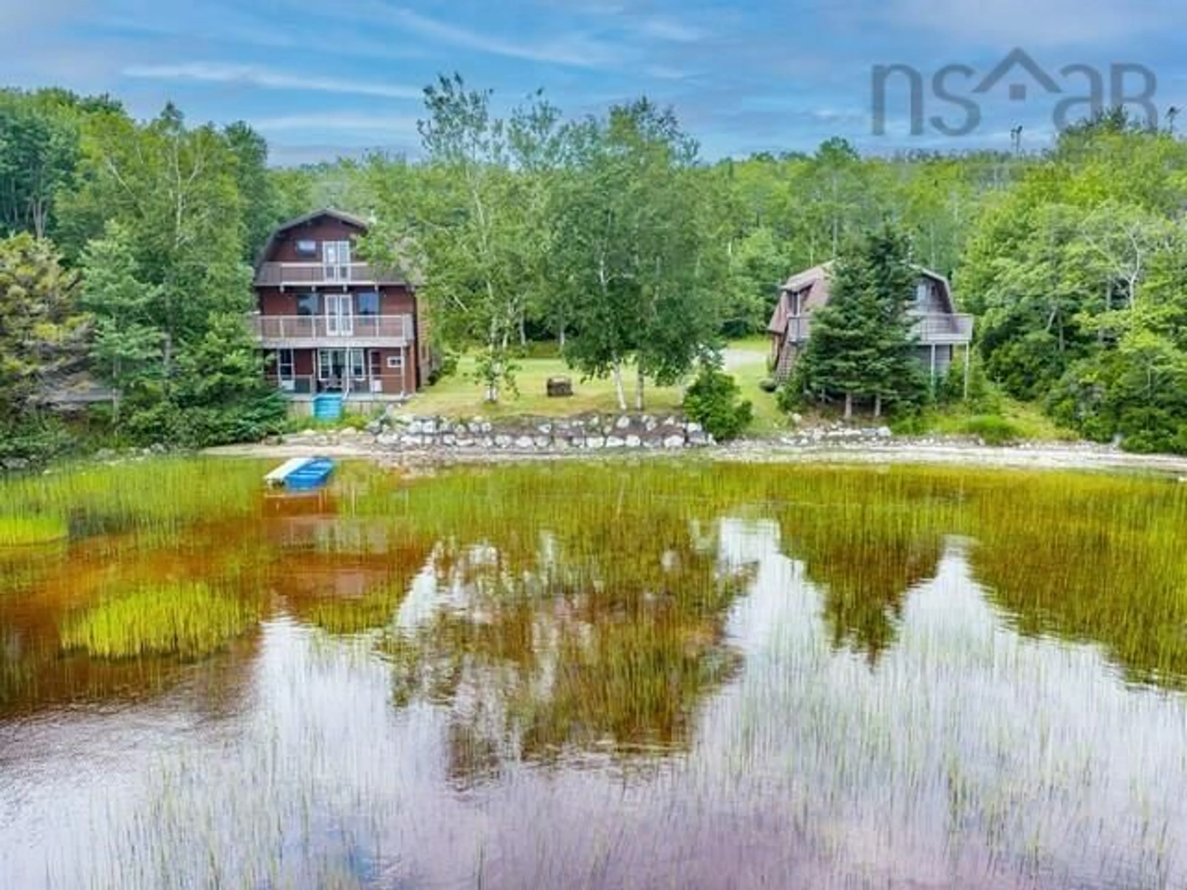 A pic from outside/outdoor area/front of a property/back of a property/a pic from drone, water/lake/river/ocean view for 233 Greenwodd Lake Road, Port Saxon Nova Scotia B0W 2S0