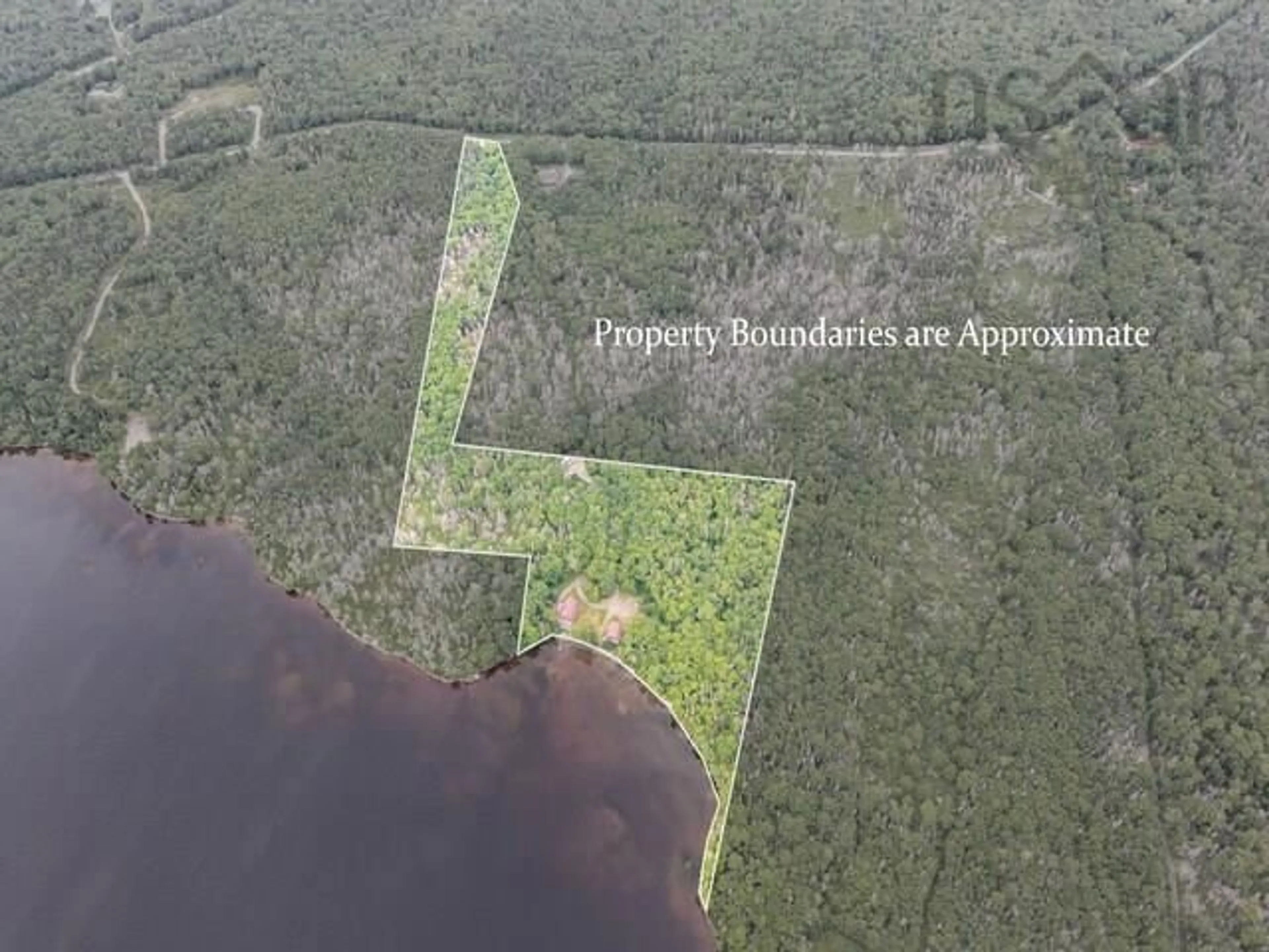 A pic from outside/outdoor area/front of a property/back of a property/a pic from drone, water/lake/river/ocean view for 233 Greenwodd Lake Road, Port Saxon Nova Scotia B0W 2S0