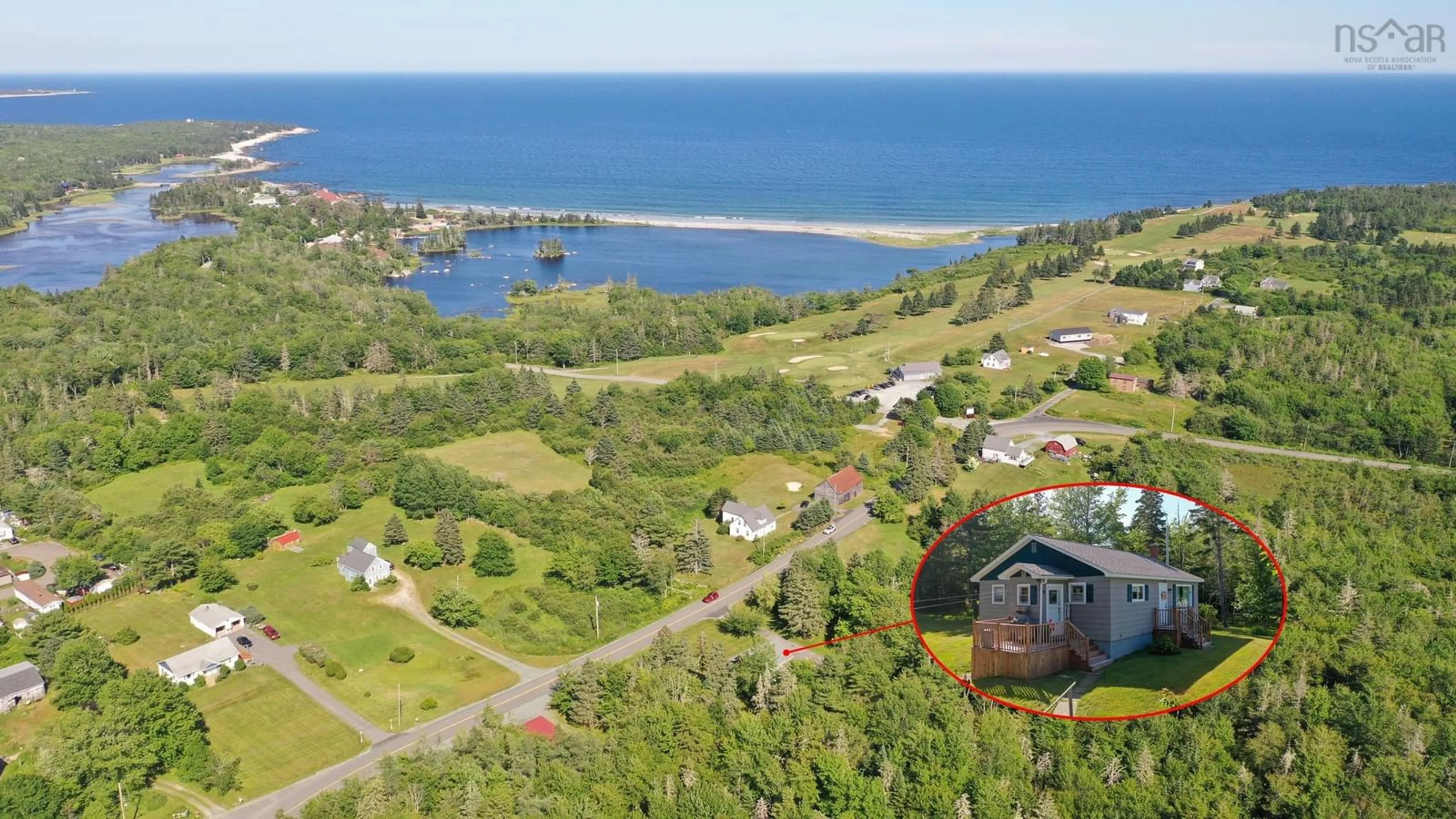 A pic from outside/outdoor area/front of a property/back of a property/a pic from drone, water/lake/river/ocean view for 38 White Point 2 Rd, White Point Nova Scotia B0T 1G0
