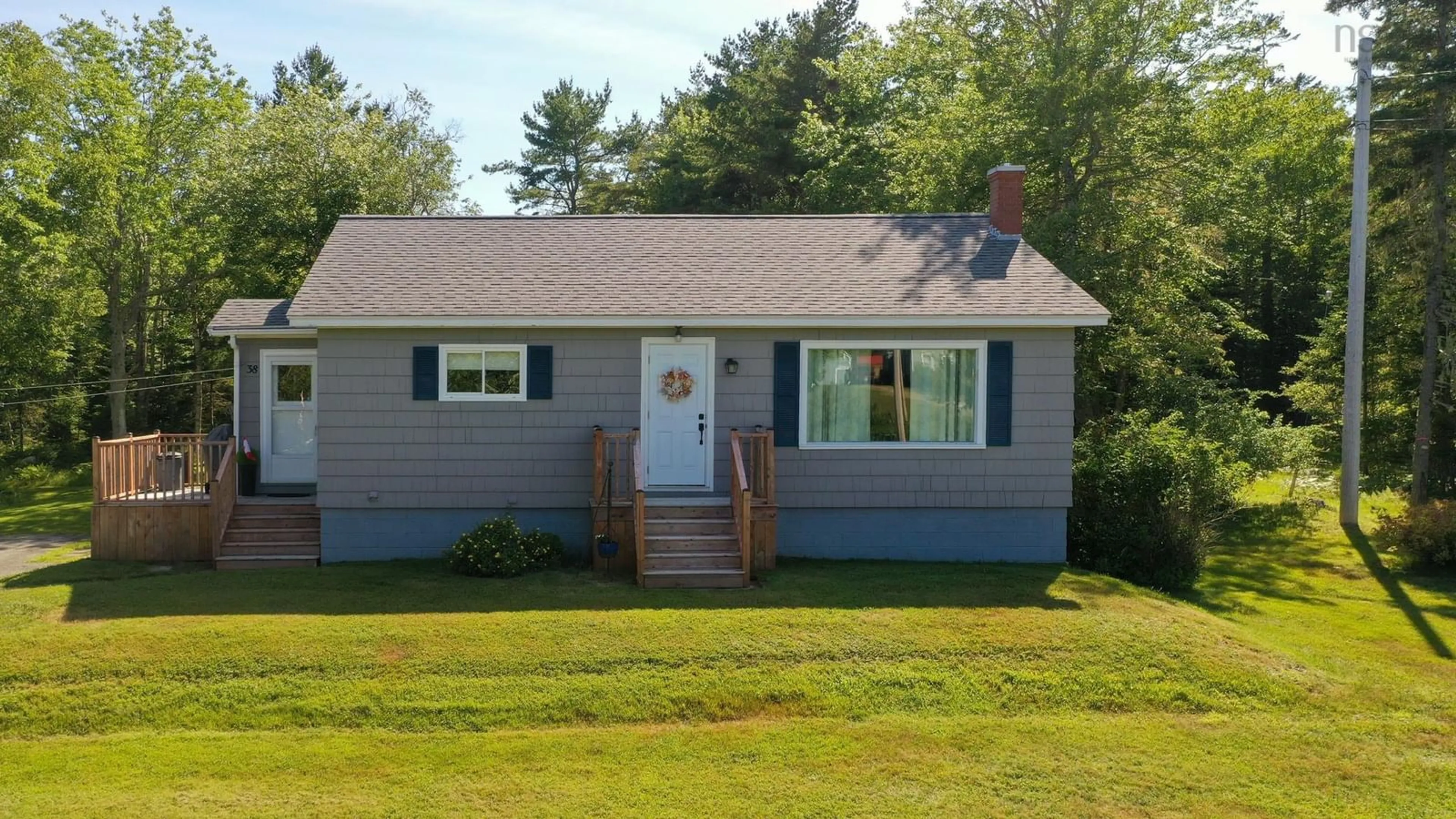 Home with vinyl exterior material, street for 38 White Point 2 Rd, White Point Nova Scotia B0T 1G0