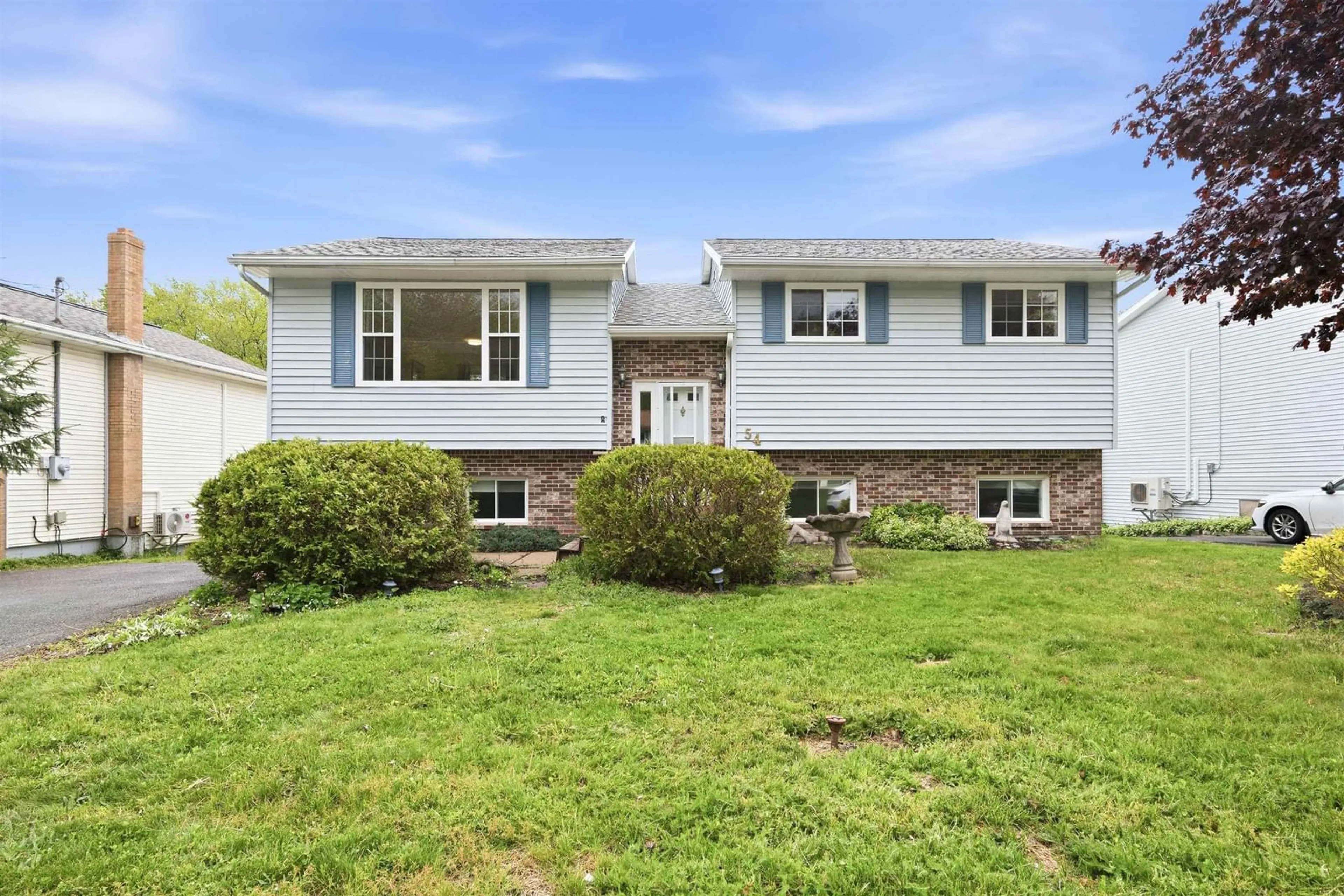 Home with vinyl exterior material, street for 54 Cartier Cres, Lower Sackville Nova Scotia B4C 3K7
