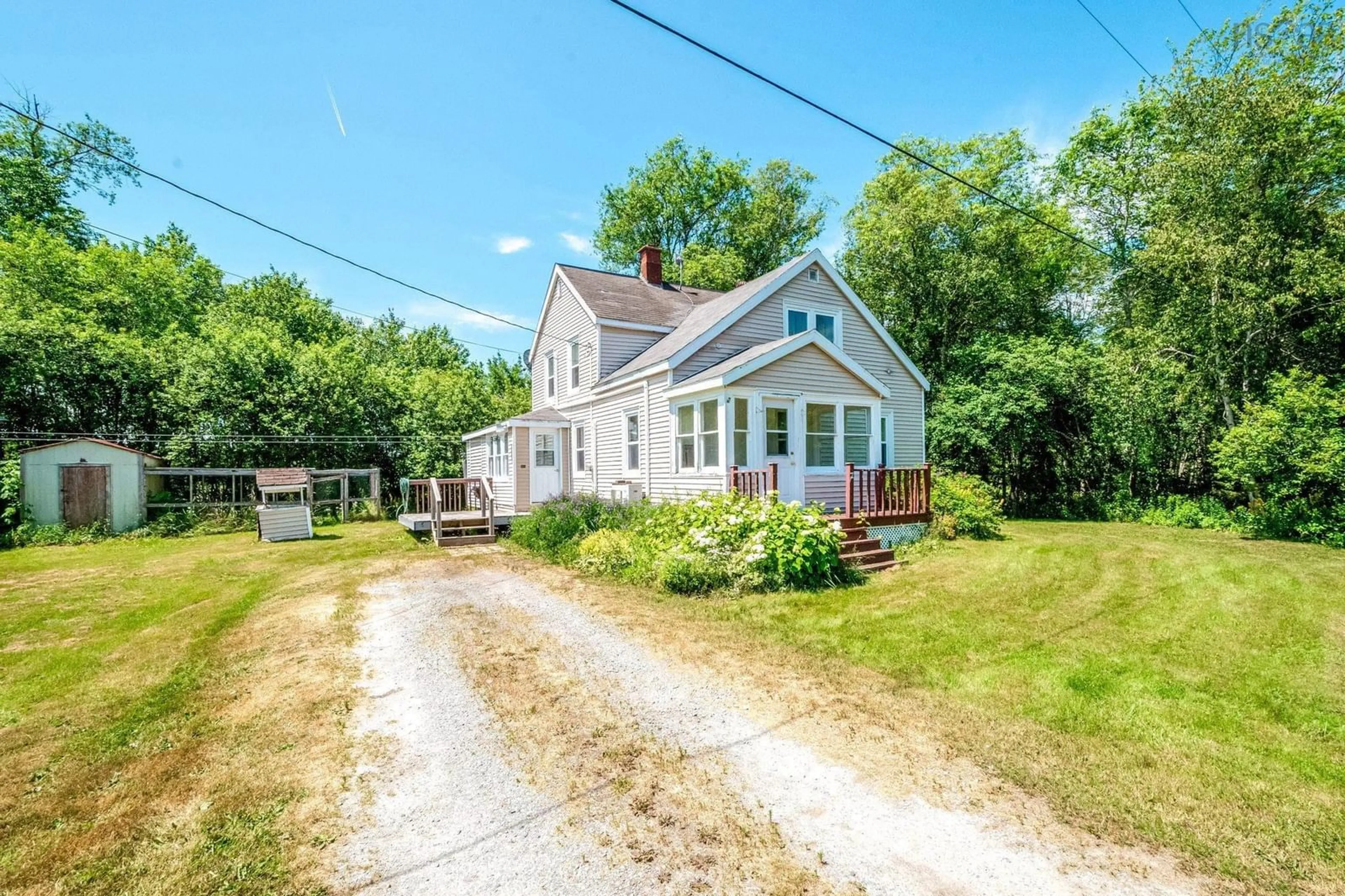 A pic from outside/outdoor area/front of a property/back of a property/a pic from drone, street for 86 Meadowvale Rd, South Branch Nova Scotia B0N 2P0