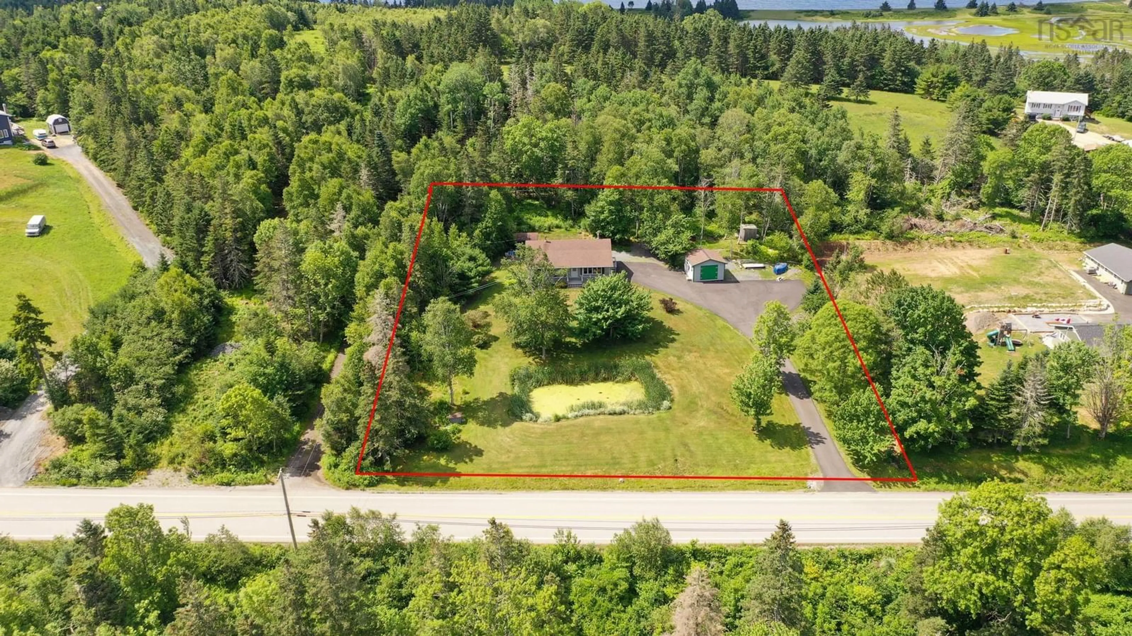 A pic from outside/outdoor area/front of a property/back of a property/a pic from drone, forest/trees view for 786 Blue Rocks Road, Garden Lots Nova Scotia B0J 2C0