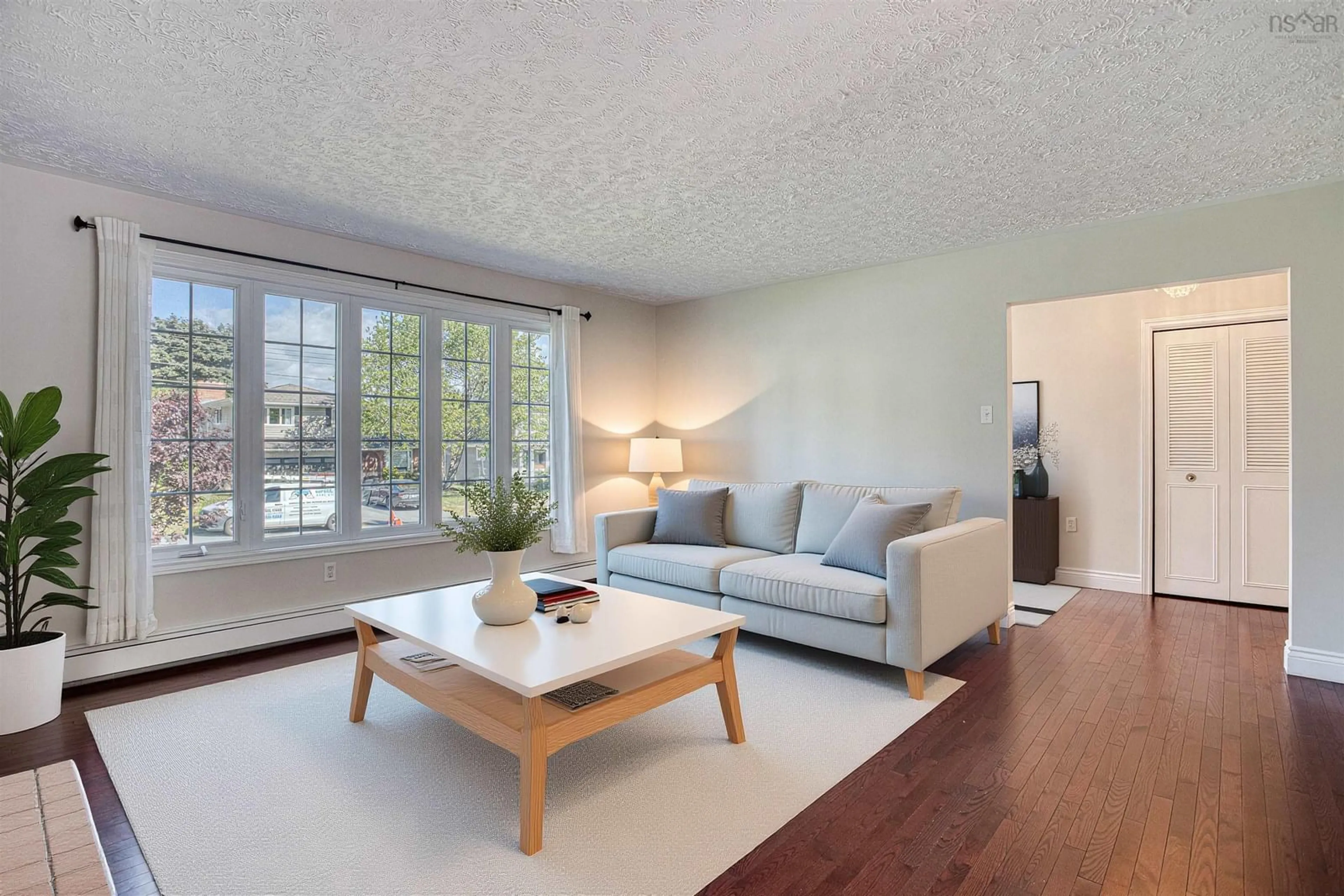 Living room with furniture, wood/laminate floor for 9 John Brenton Dr, Dartmouth Nova Scotia B2X 2V6