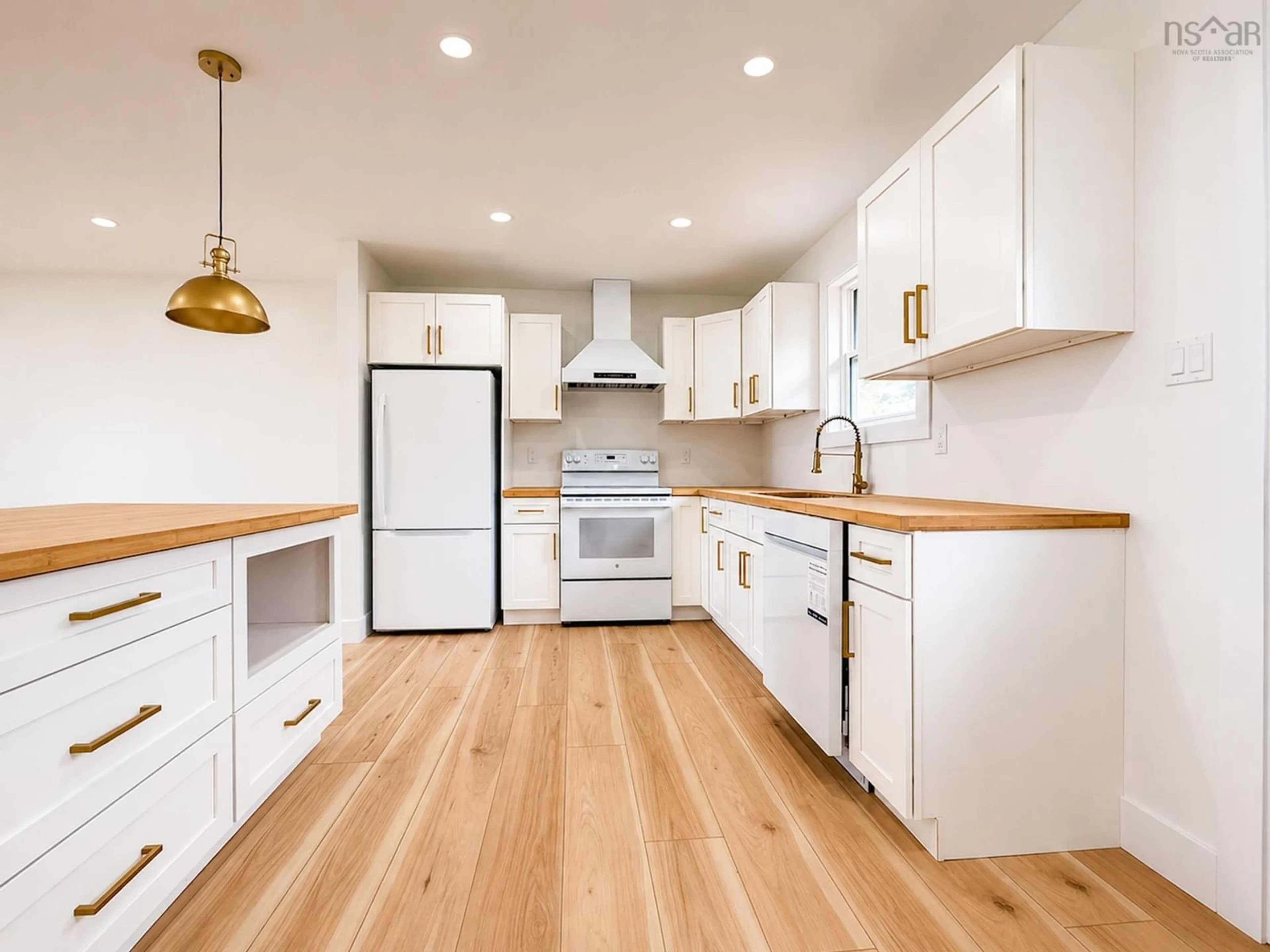 Open concept kitchen, wood/laminate floor for 967 Westmount Rd, Westmount Nova Scotia B1R 1C5