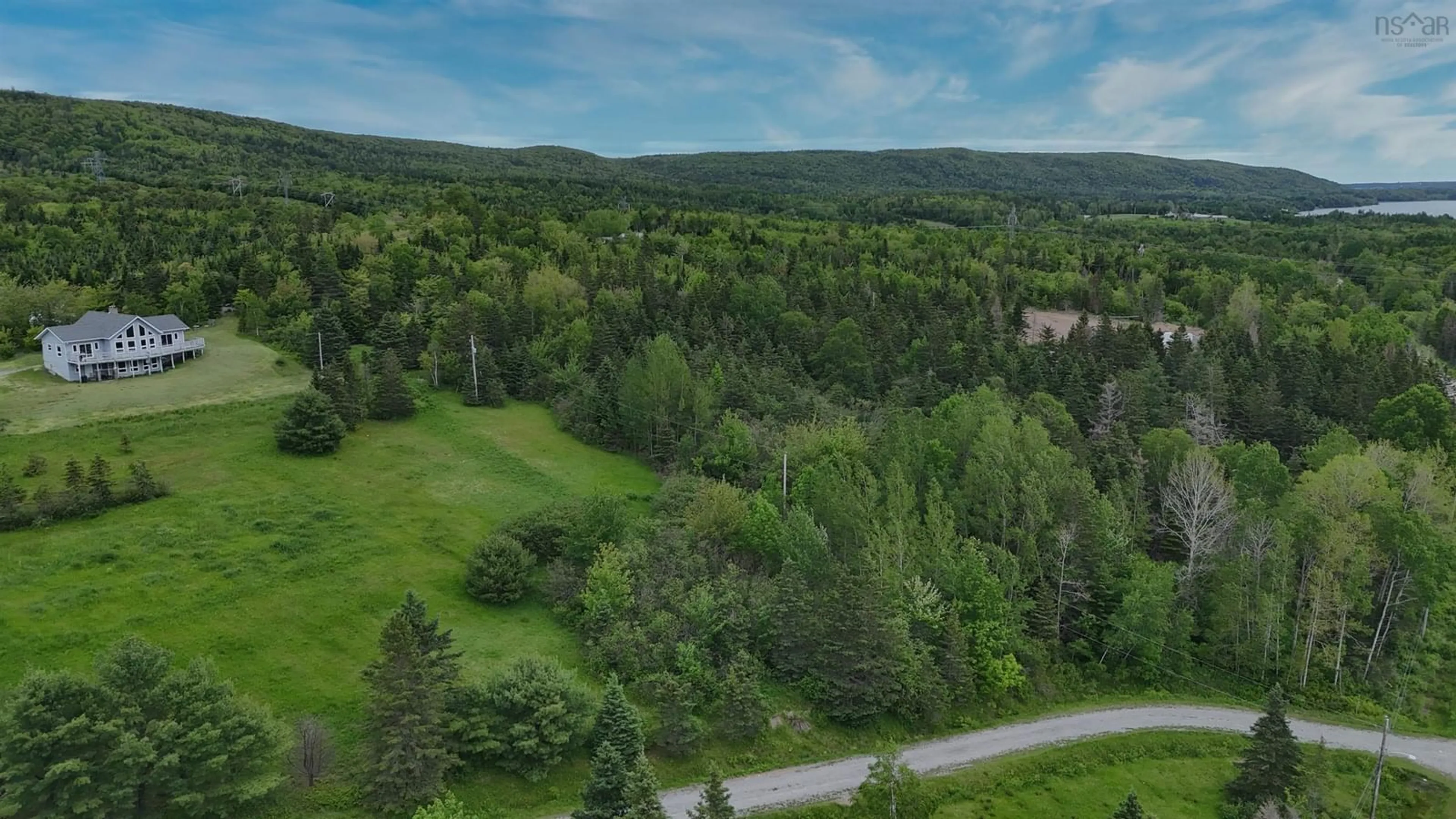 A pic from outside/outdoor area/front of a property/back of a property/a pic from drone, forest/trees view for 2420 Coxheath Rd, Blacketts Lake Nova Scotia B1L 1A5